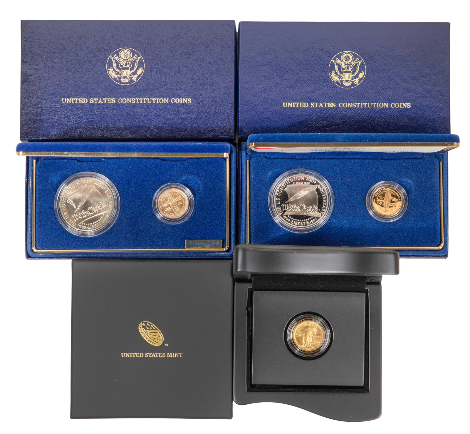 US Mint Gold Coins: US Mint Gold Coins Including (2) 1987 Constitution sets and a 2016 Standing Liberty 25c Centennial, in presentation boxes Property from: a Private Collector, River Grove, Illinois Category: