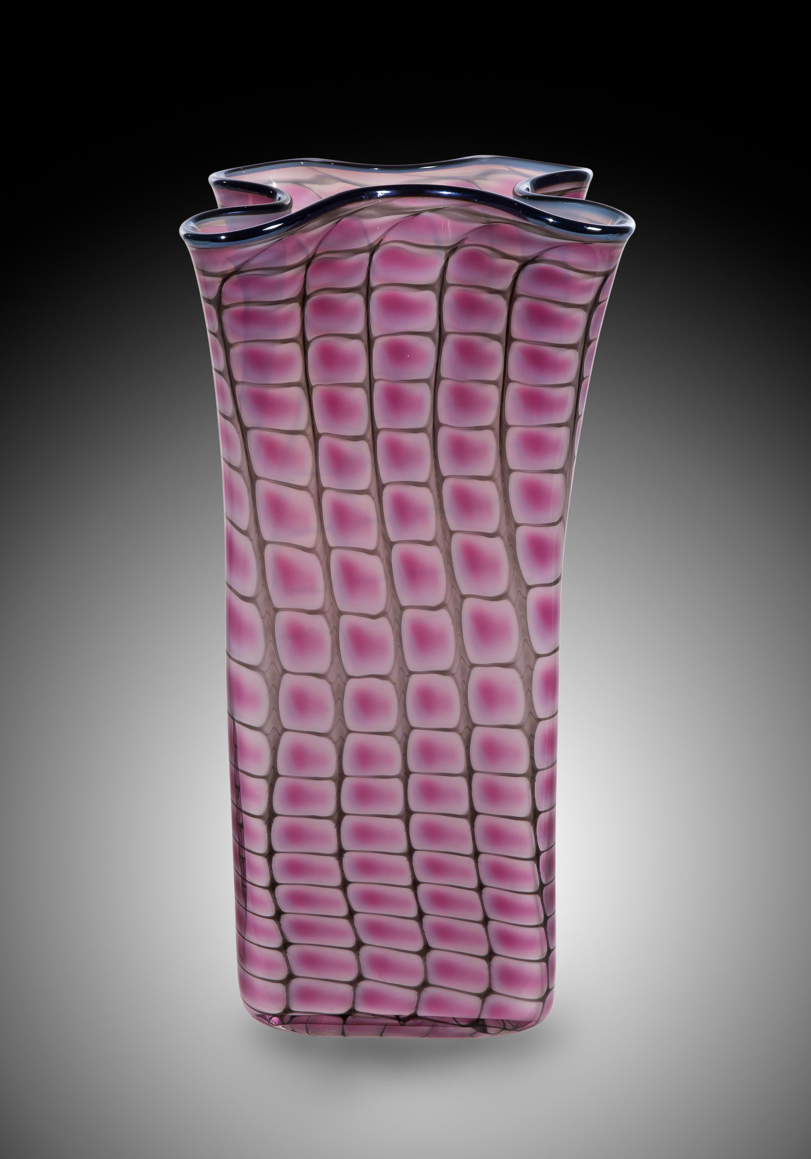Tom Philabaum (American, b.1947) Reptilian Art Glass Vase: Tom Philabaum (American, b.1947) Reptilian Art Glass Vase 2000, etch signed, blown glass vase in pink and black Property from: an Estate, Mequon, Wisconsin Height: 14 1/2 inches, Width: 6 inches,