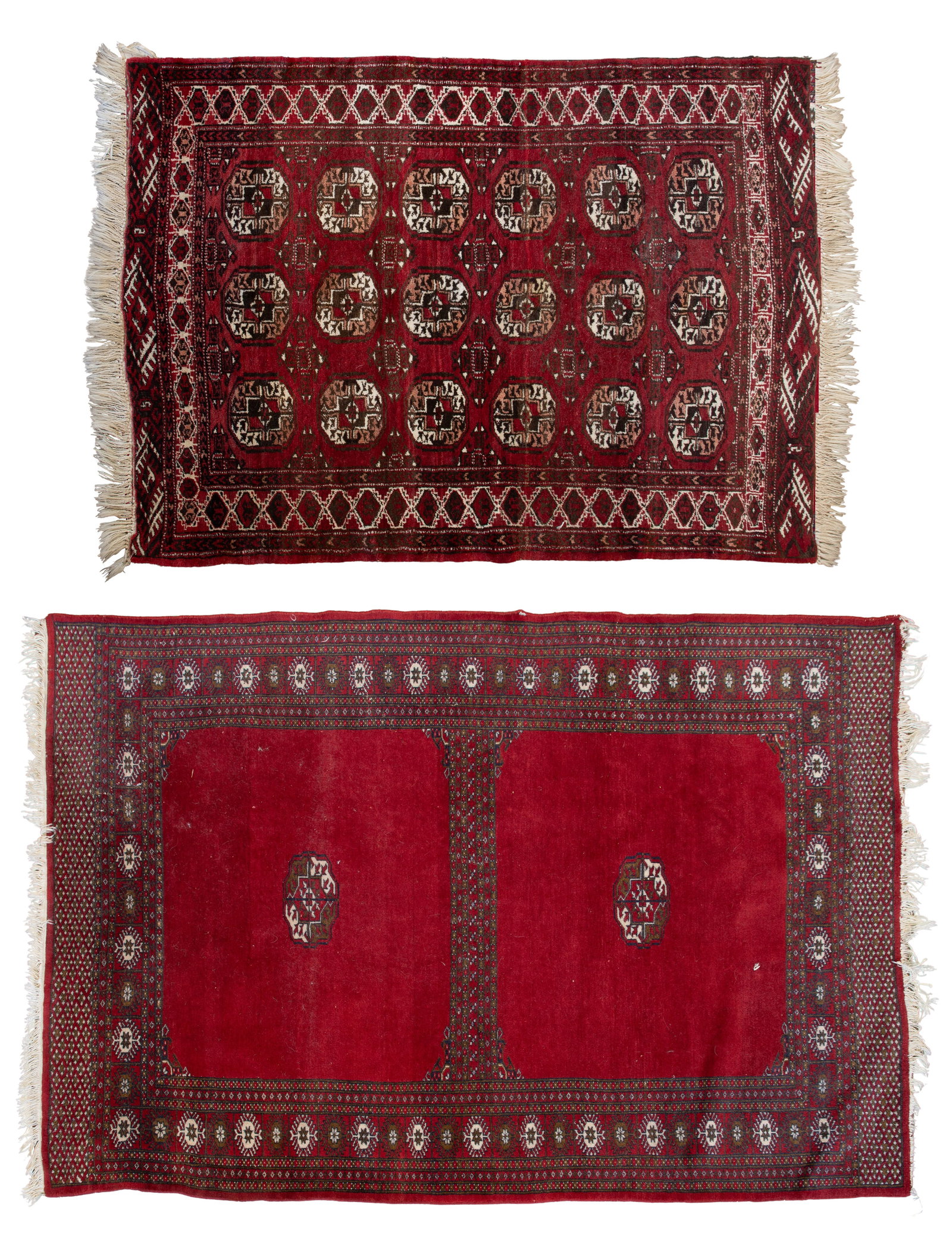 Persian Wool Rugs: Persian Wool Rugs (2) items in the Bokhara style having octagonal or diamond-shaped repeating motif in hues of brown, black and cream on a red field (smaller 4 ft. 10 in. x 3 ft. 5 in.) Property
