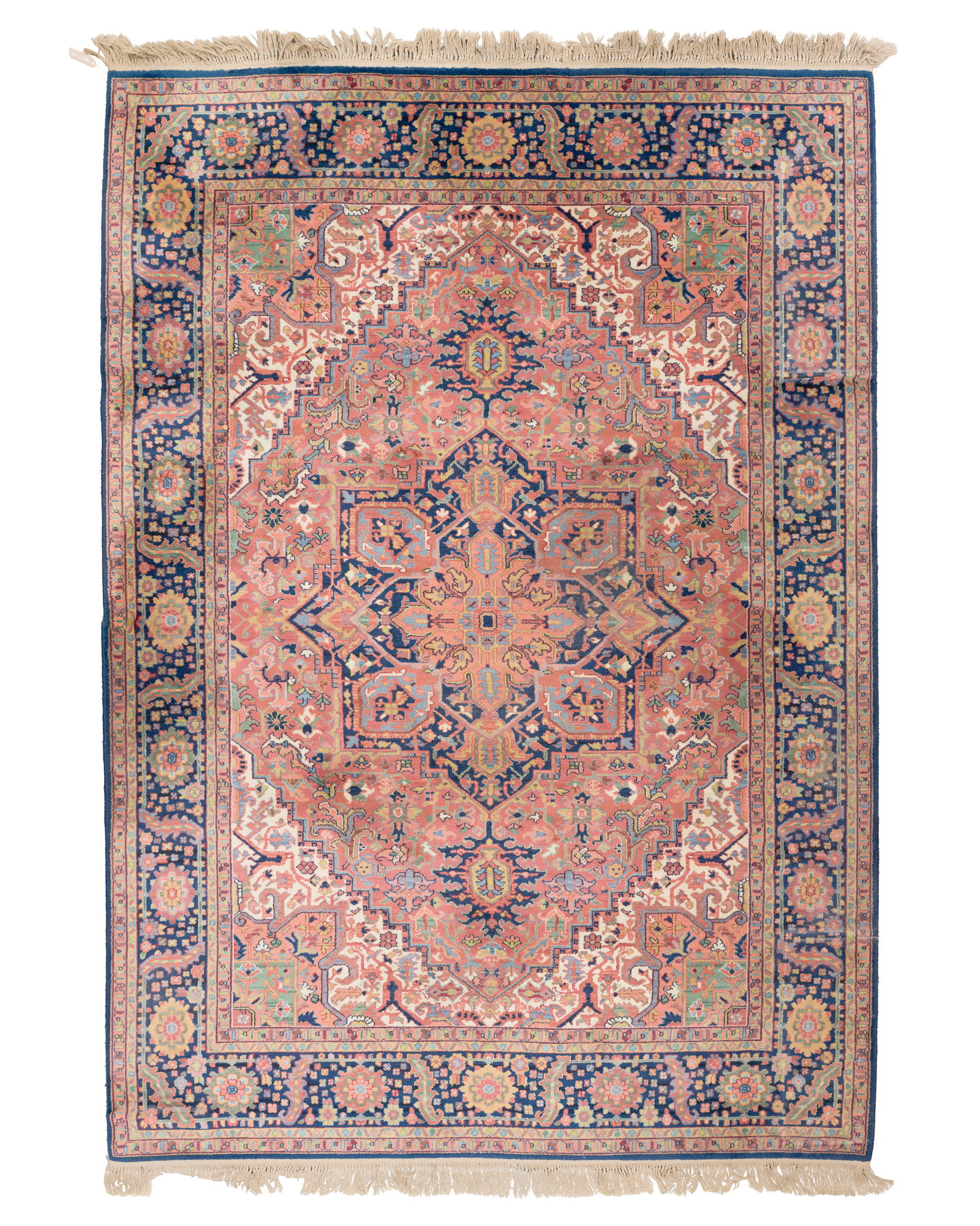 Karastan Heriz Serapi Wool Rug: Karastan Heriz Serapi Wool Rug Having a geometric design in hues of blue, green and pink on a coral field, retaining original label Property from: a Private Collector, Lake Forest, Illinois Rug Size: