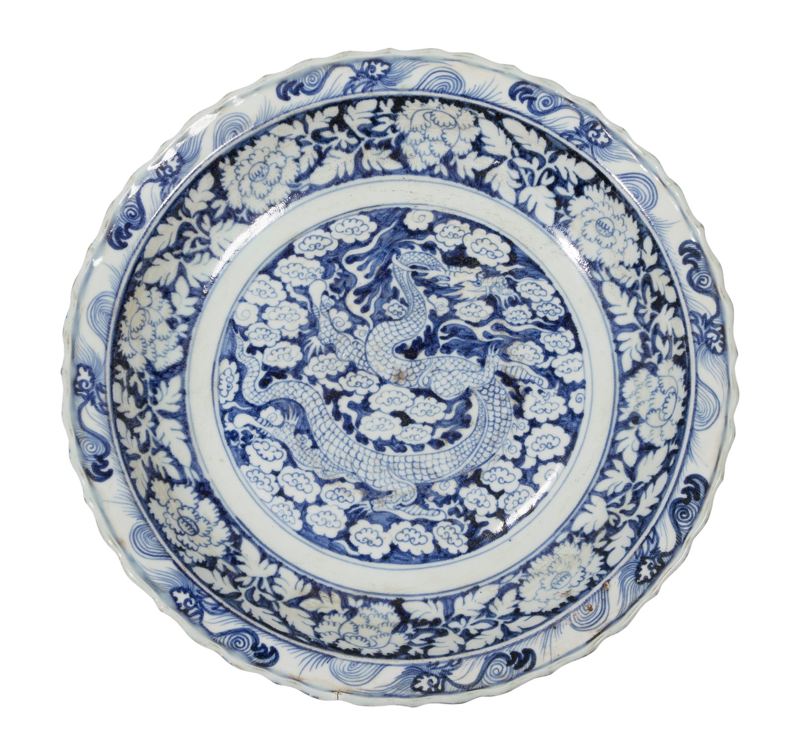 Chinese Dragon Porcelain Charger: Chinese Dragon Porcelain Charger A hand-painted cobalt blue and white dragon motif against a background of stylized clouds, scalloped rim Property from: a Private Collector, Sanford, Florida Height: 2