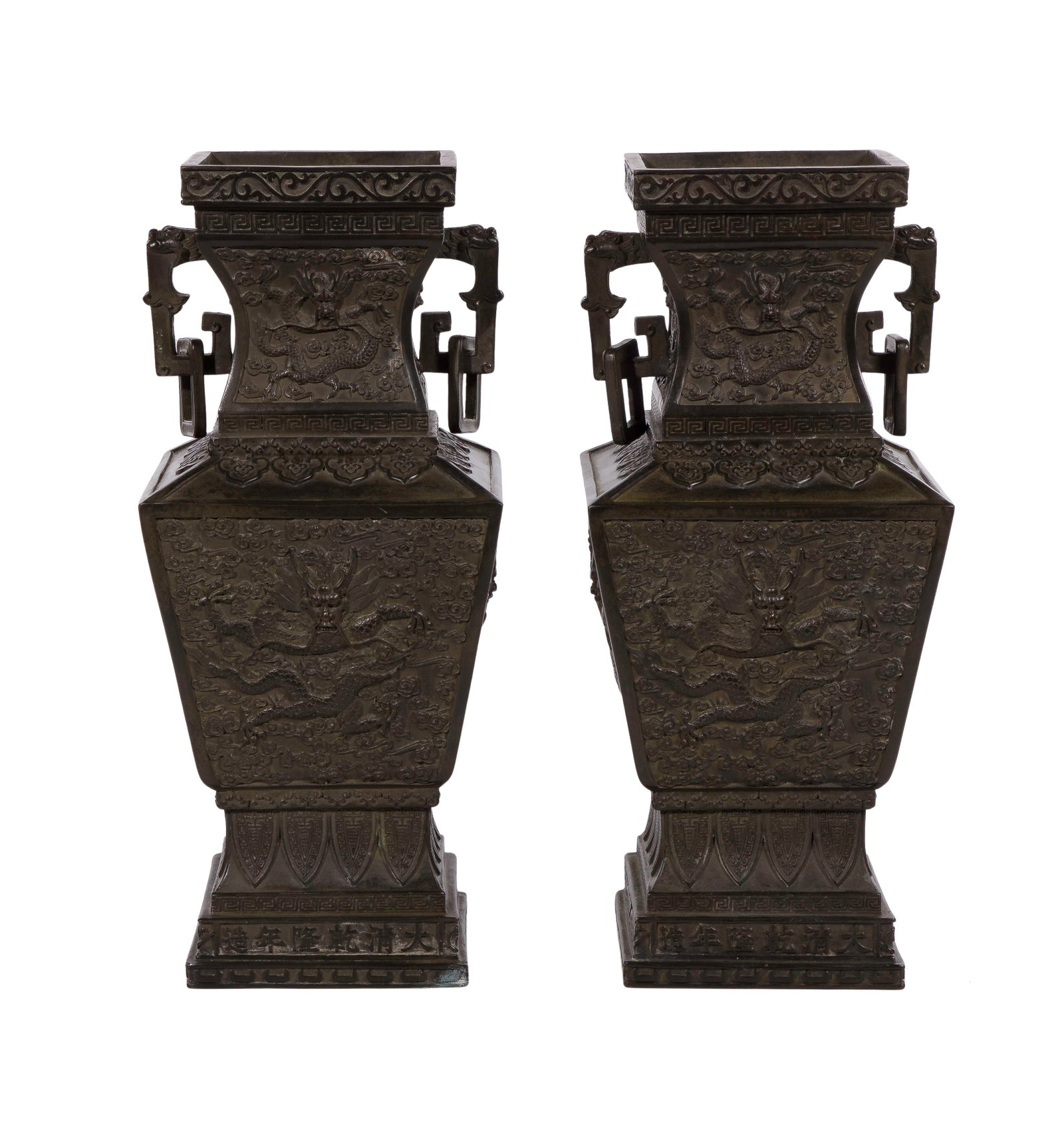 Chinese Bronze Vases: Chinese Bronze Vases A matching pair of square sectioned baluster form double-handled vases, each panel having an imperial dragon in pursuit of pearls and scrolling clouds Property from: a Private