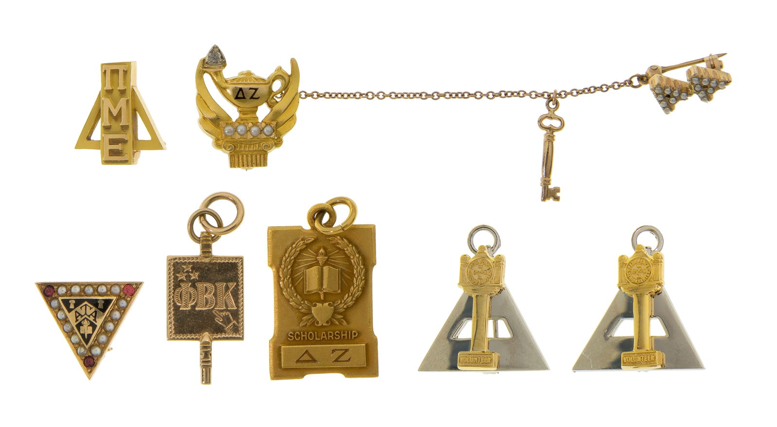 14k and 10k Gold Fraternal Pin Assortment: 14k and 10k Gold Fraternal Pin Assortment (7) items including (2) (unmarked 14k), a mixed gold (marked '14k' and '10k'), a mixed metal (clock marked '10k', triangle marked '0.830 silver') and (2)