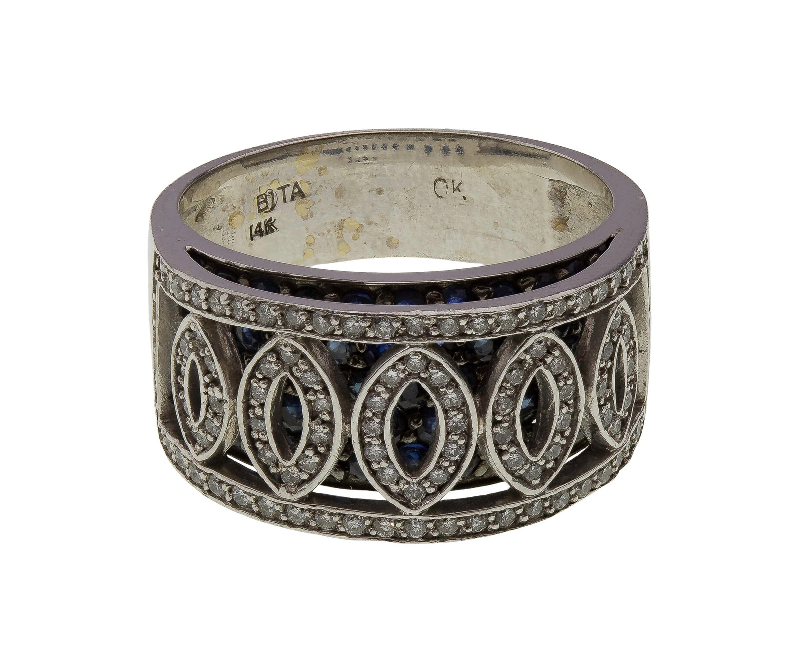 14k White Gold, Sapphire and Diamond Ring: 14k White Gold, Sapphire and Diamond Ring A 0.50-inch wide band having a marquise pattern of round cut diamond accents domed over a bed of blue sapphire accents (marked '14k') Property from: an Estate