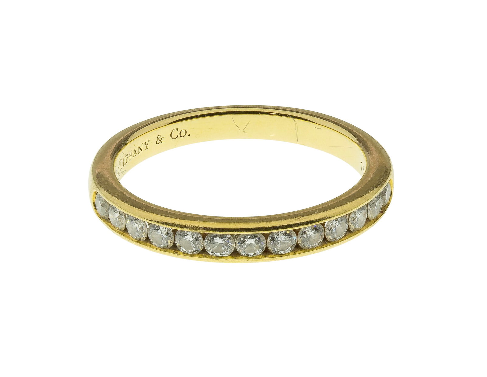 Tiffany & Co. 18k Yellow Gold and Diamond Ring: Tiffany & Co. 18k Yellow Gold and Diamond Ring A half eternity setting having a row of channel set round cut diamonds, Tiffany & Co. presentation box (marked '750') Property from: a Private Collector,