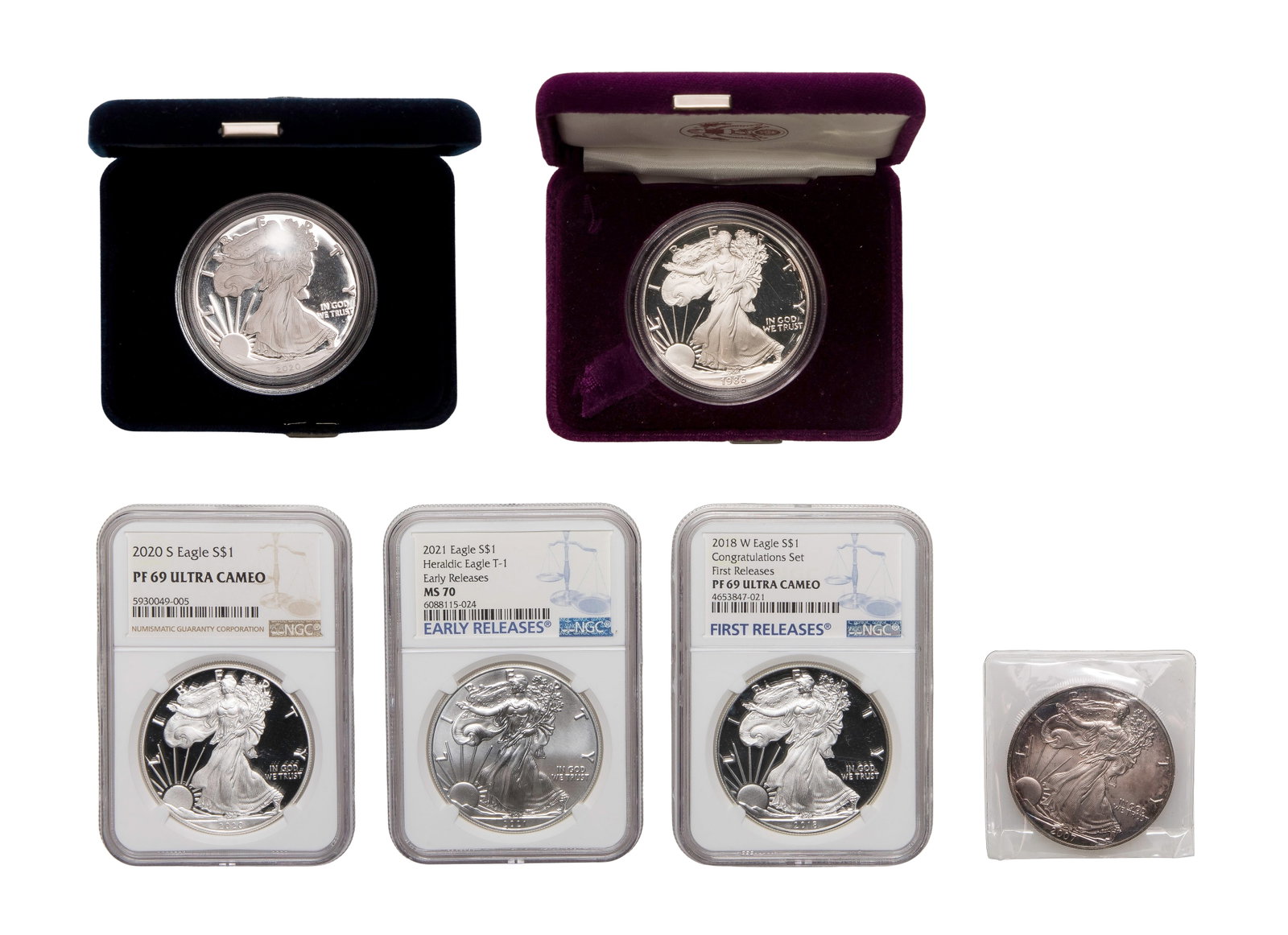 $1 American Eagle Assortment: $1 American Eagle Assortment (6) coins including a 1986 and a 2020 having plastic cases, boxes and inserts as well as graded including a 2018-W and a 2020-S both PF-69 Ultra Cameo NGC, a 2021 MS-70