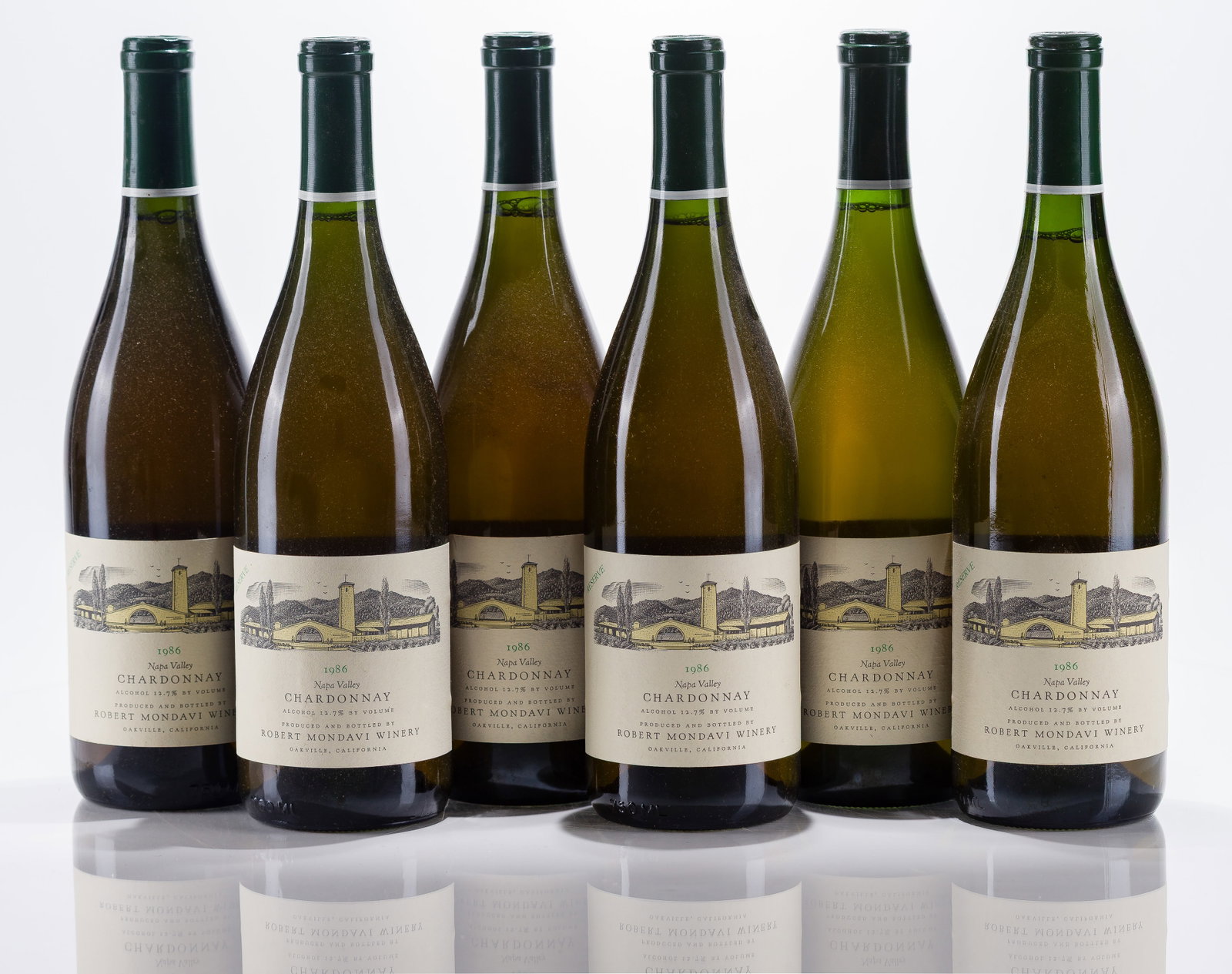 1986 Robert Mondavi Winery Chardonnay: 1986 Robert Mondavi Winery Chardonnay 1986 Robert Mondavi Winery Reserve Chardonnay (6x 750ml), Oakville, California, fill: N, labels: fully legible, intact having minor shelf wear, capsules / corks: 