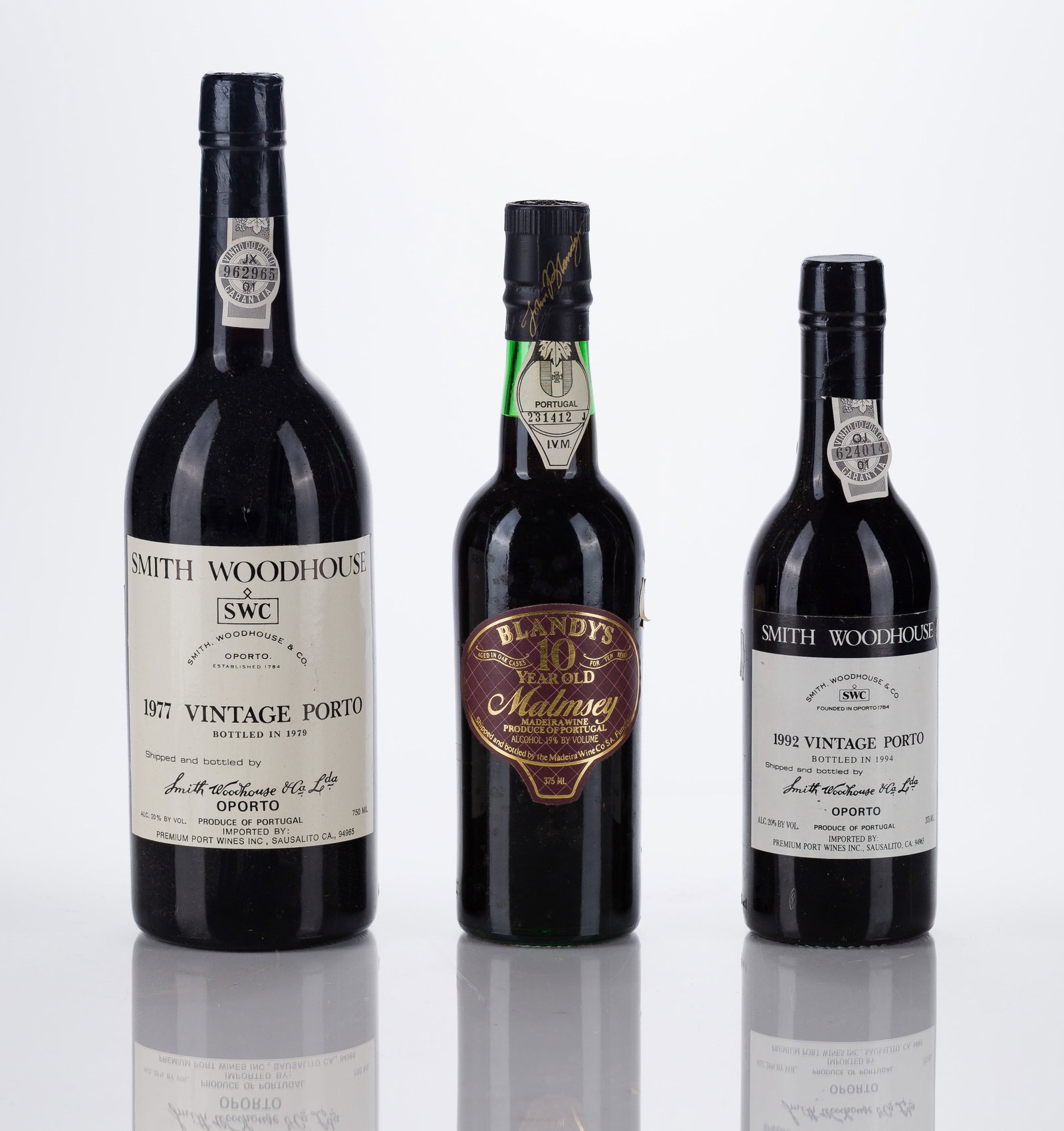 Portuguese Mixed Wines: Portuguese Mixed Wines 1977 (1x 750ml) and 1992 (1x 375ml), Smith Woodhouse Vintage Port, Oporto, Portugal, fill: BN, labels: fully legible, intact having minor shelf wear, capsules / corks: firm,