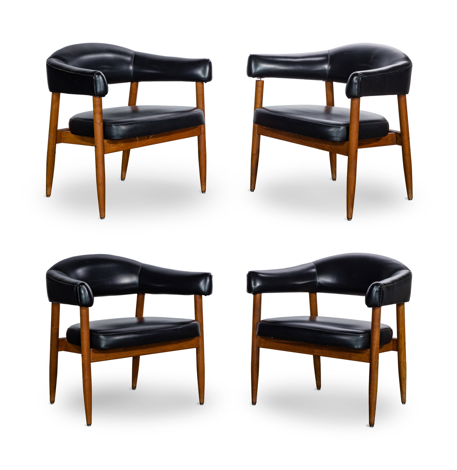 Mid-Century Modern Style Armchair Collection: Mid-Century Modern Style Armchair Collection (4) items having a curved back and arms on a wood frame, upholstered in black faux leather Property from: an Estate, Antioch, Illinois Height: 28 inches, W