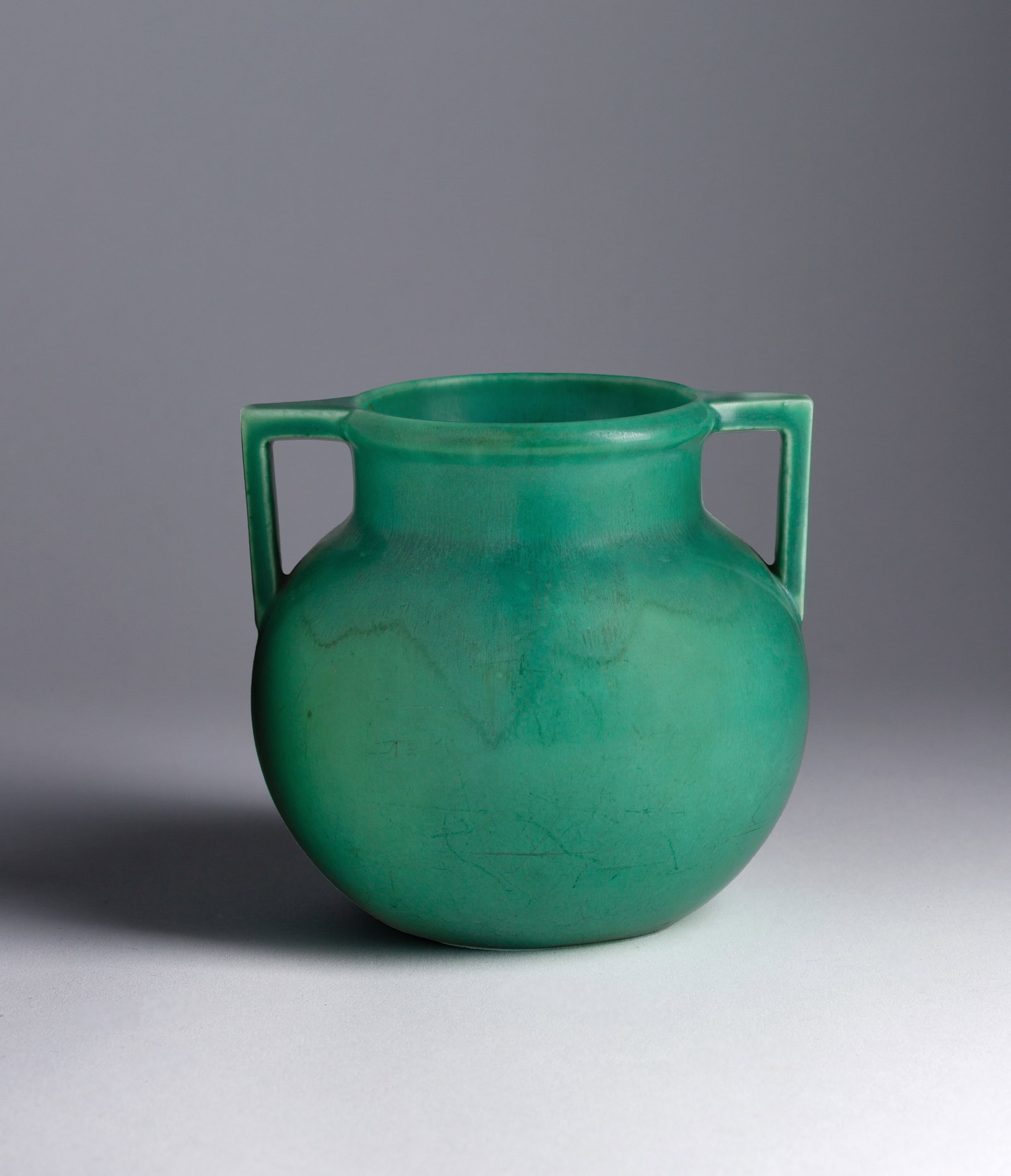 Rookwood Pottery Vase: Rookwood Pottery Vase 1928, sea green 2-handled vase model #2078 having 'XXVIII' to underside Property from: an Estate, Hinsdale, Illinois Height: 4 7/8 inches, Width: 5 1/4 inches, Depth: 5 inches