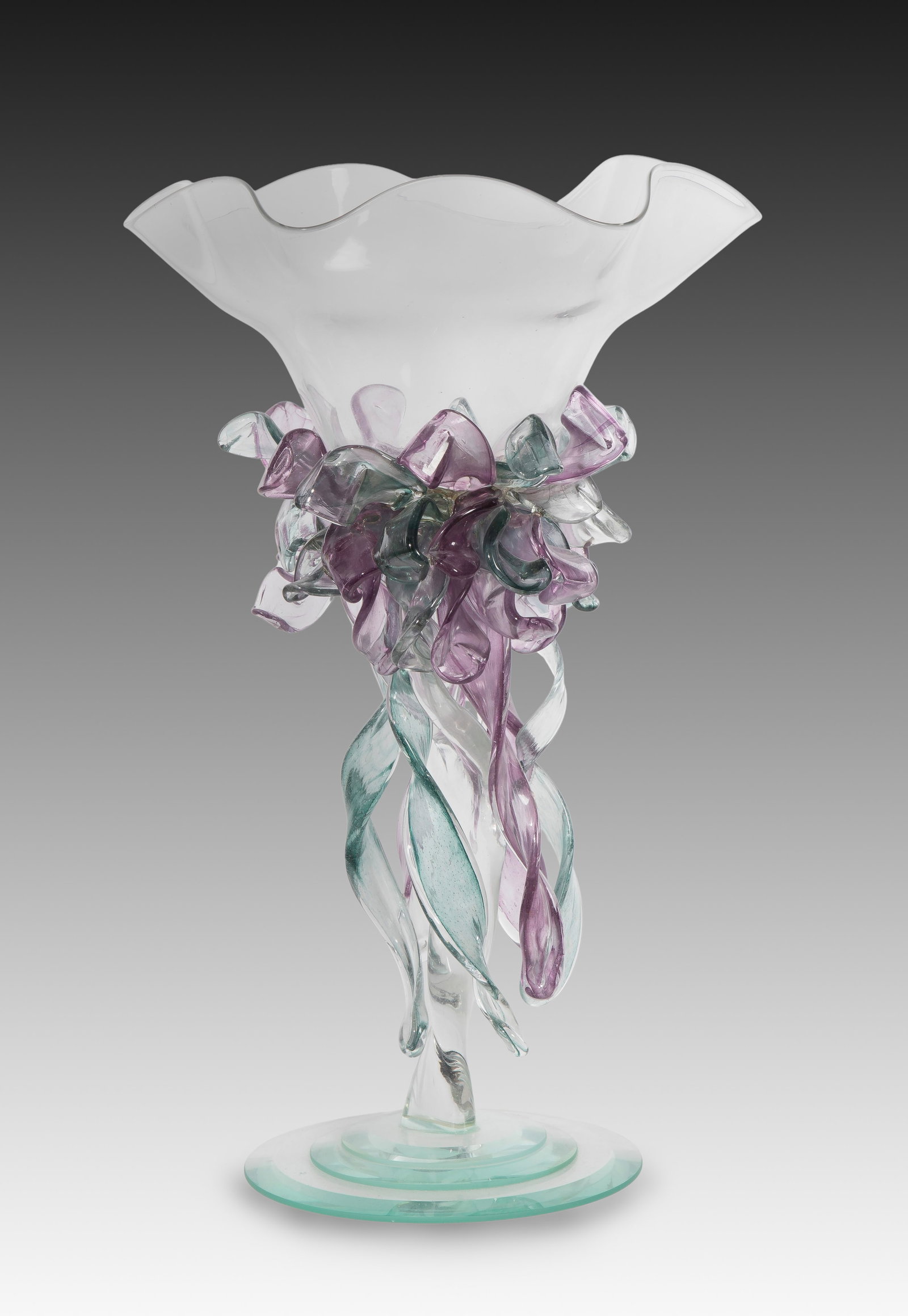 Art Glass Vase: Art Glass Vase A Murano style art glass vase having a ruffled, clear top, swirling purple and green ribbons, on a stepped foot Property from: an Estate, Grafton, Wisconsin Height: 15 inches, Diameter: