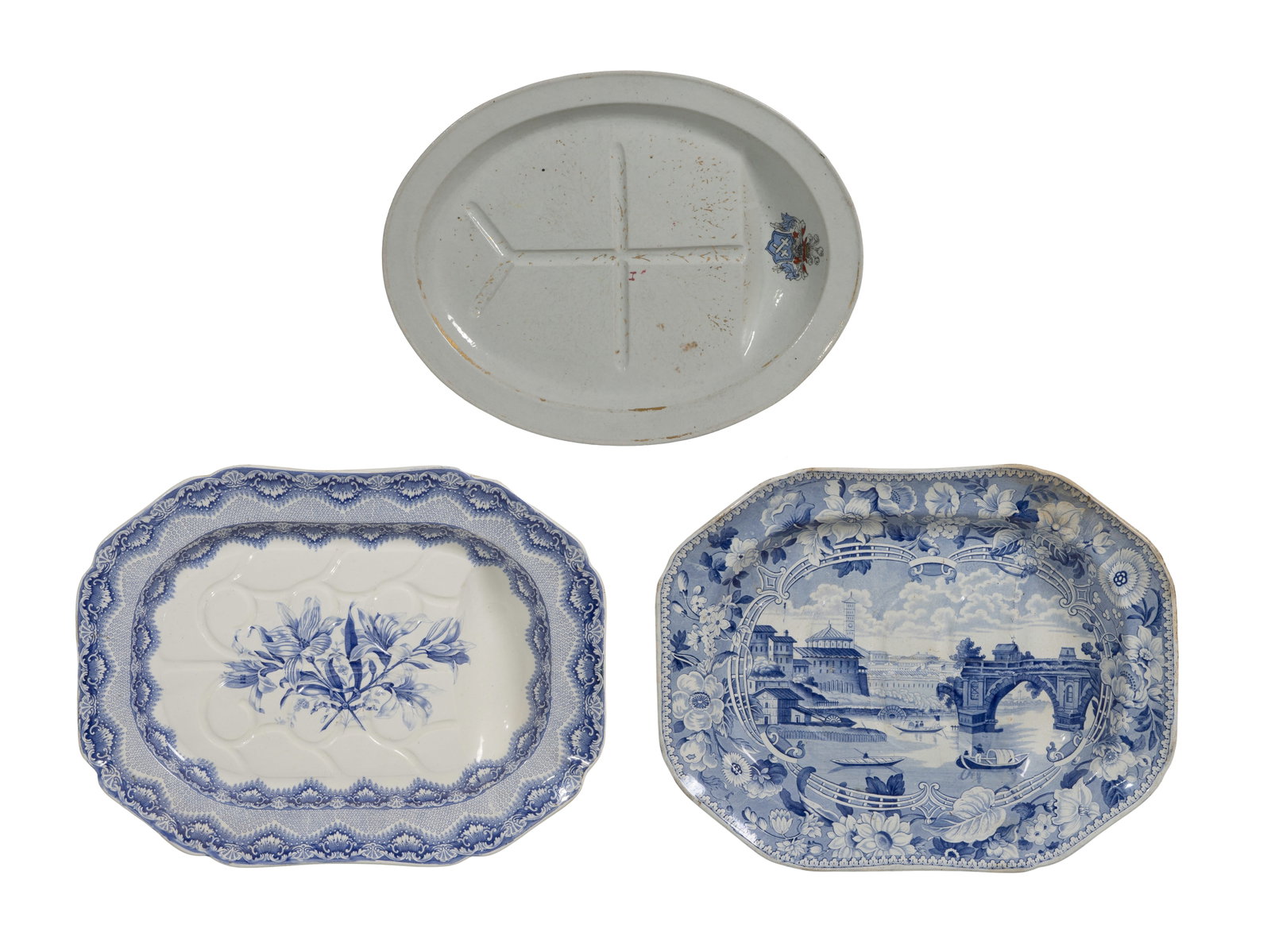 Ironstone Platter Assortment: Ironstone Platter Assortment (3) items including (2) blue and white transferware ceramic meat platters featuring scenic and floral motifs from makers Spode and Ponte Rotto as well as a gilt accented w