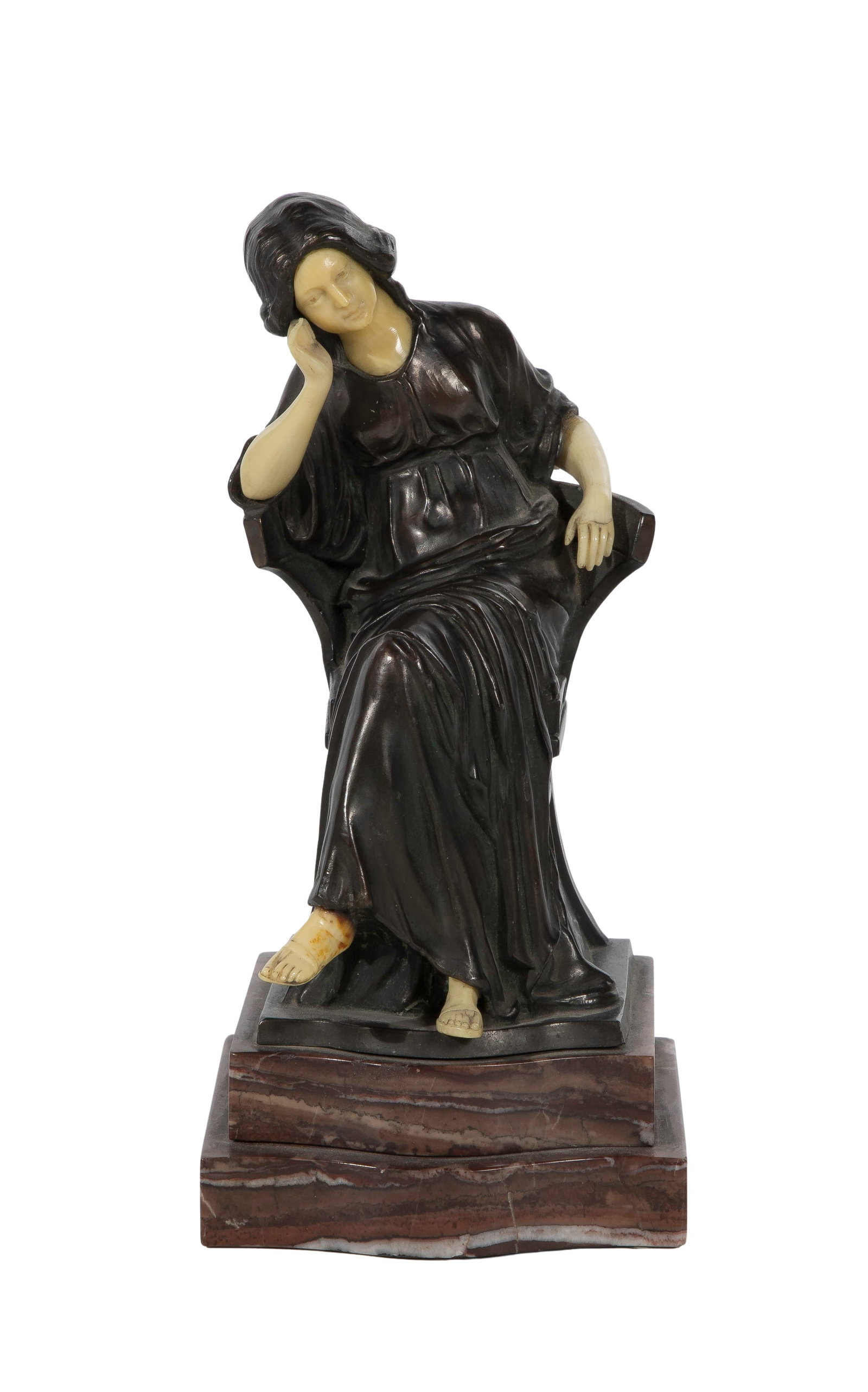 Patinated Bronze Sculpture: Patinated Bronze Sculpture A dark patinated bronze body paired with carved chryselephantine elements for the face, arms and feet, all mounted on a variegated marble plinth, marked 'Germany' on