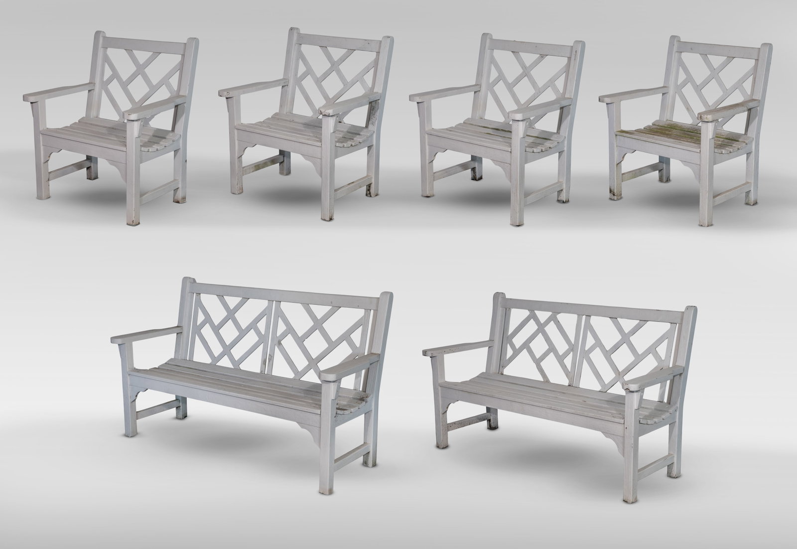 Smith and Hawkins Teak Seating Assortment: Smith and Hawkins Teak Seating Assortment (6) items including a pair of benches and a set of (4) armchairs, all having fretwork backs and geometric lines, retaining metal tags Property from: a Private