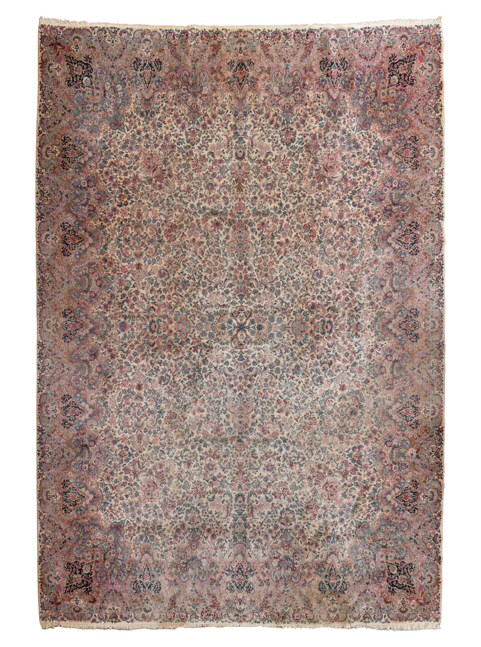 Karastan Kirman Wool Rug: Karastan Kirman Wool Rug Having a floral motif in hues of wine, blue, brown, pink and black on a cream field, retaining original label Property from: an Estate, Hinsdale, Illinois Rug Size: 14 by 11 f