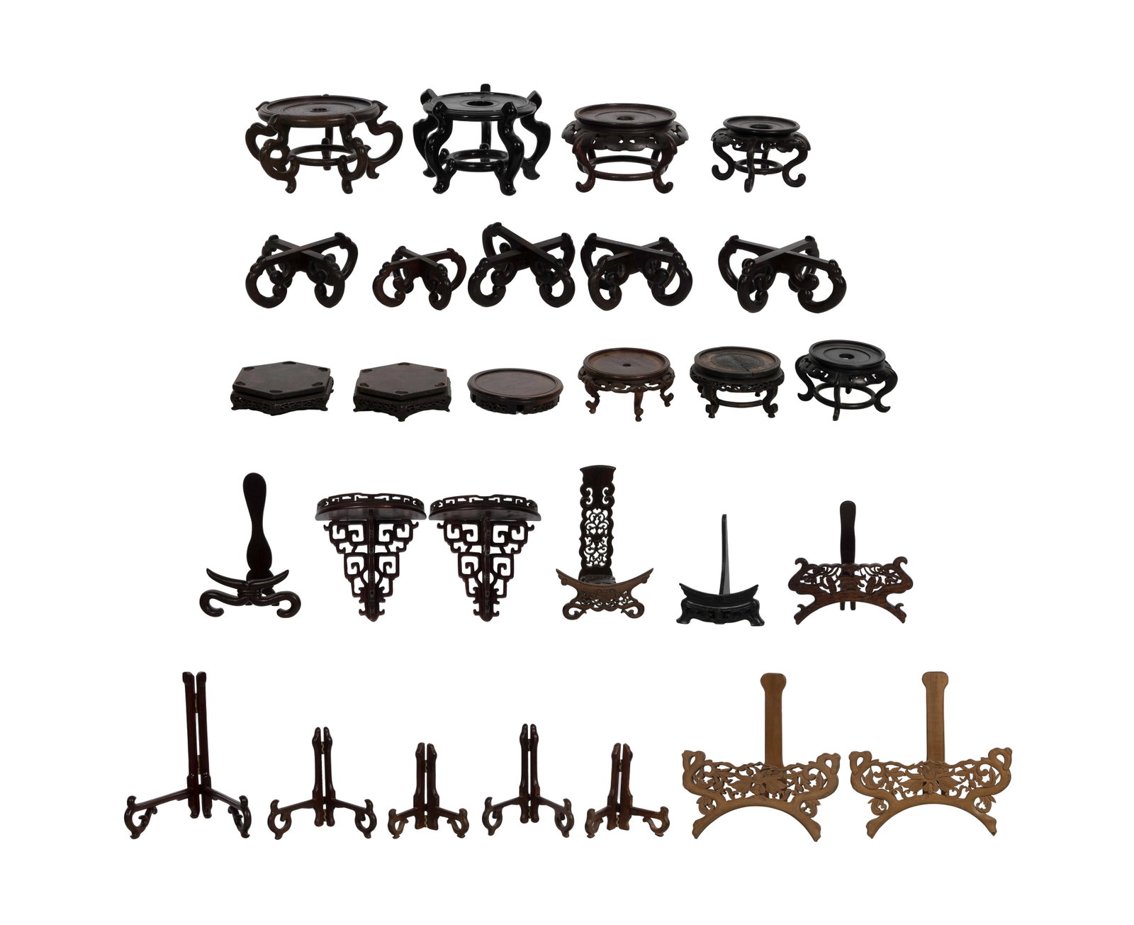 Asian Wood Stand Assortment: Asian Wood Stand Assortment (28) Chinese carved wood display stands, known as basethe or vase stands and easels Property from: a Private Collector, Wheaton, Illinois Height: 5 inches, Diameter: 10