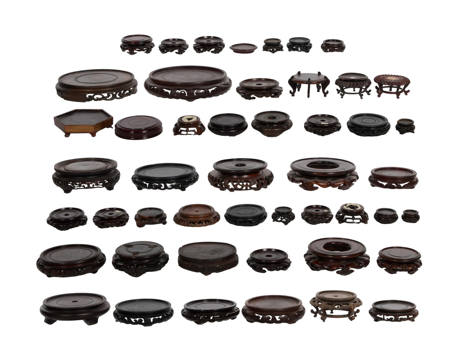 Asian Wood Stand Assortment: Asian Wood Stand Assortment (48) Chinese carved wood display stands, known as basethe or vase stands Property from: a Private Collector, Wheaton, Illinois Height: 3 inches, Diameter: 6 1/2 inches