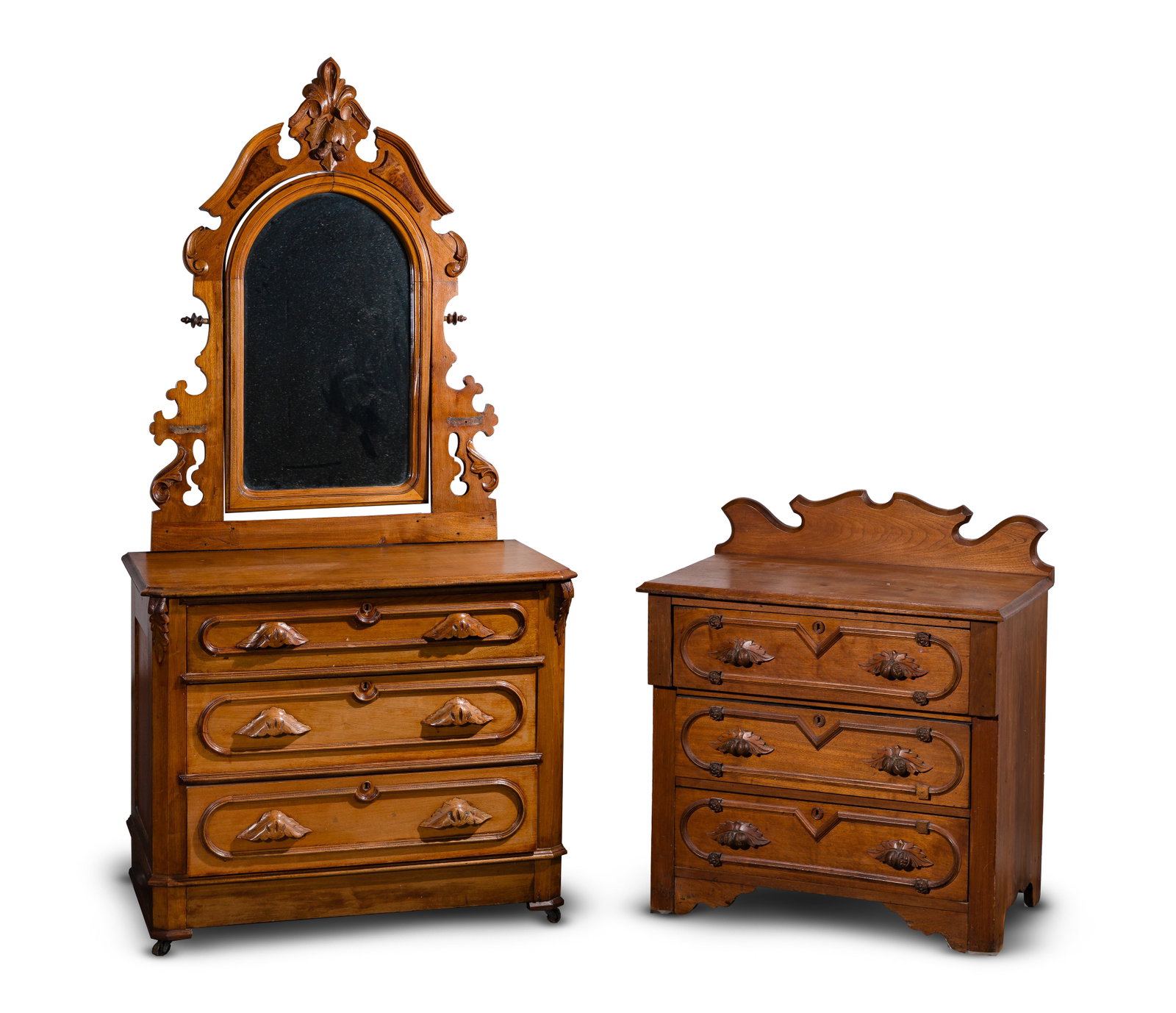 Eastlake Style Walnut Dressers: Eastlake Style Walnut Dressers (2) three-drawer chests, each having carved wood handles and decorative molding, the larger having an adjustable mirror Property from: a Private Collector, Wheaton, Illi