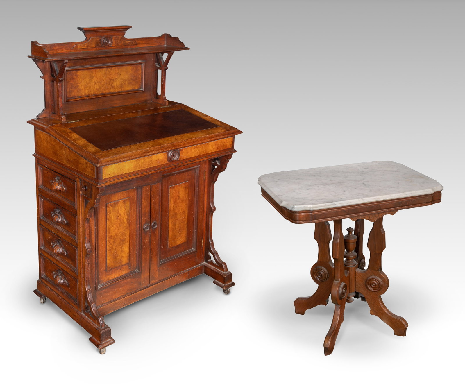 Eastlake Style Walnut Desk and Marble Top Table: Eastlake Style Walnut Desk and Marble Top Table (2) items including a Davenport style desk having burled veneer, leather writing surface and side drawers with hand carved handles and a Renaissance