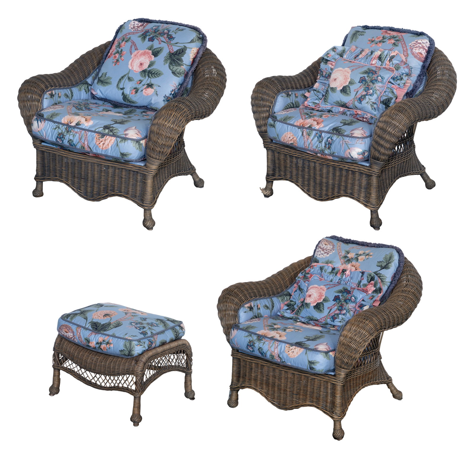Wicker Upholstered Armchair and Ottoman Assortment: Wicker Upholstered Armchair and Ottoman Assortment (4) natural rattan items including (3) armchairs having floral chintz upholstered seats, backs and inner arms and matching reversible loose cushions