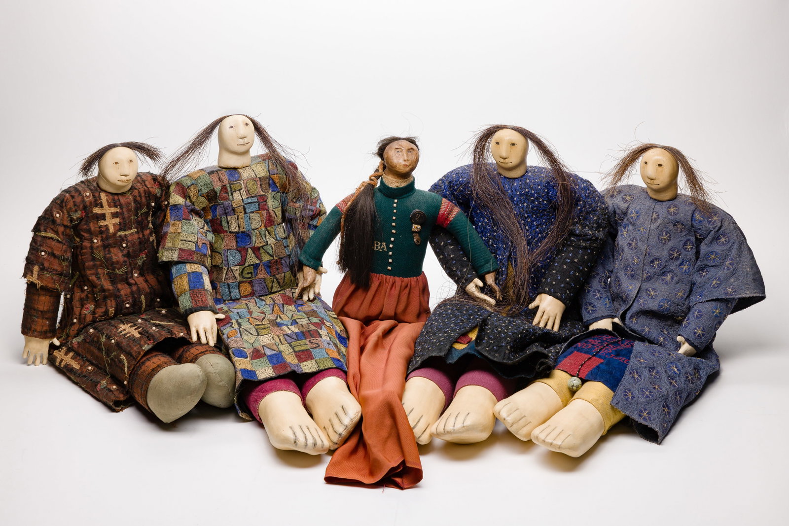 Charla Khanna (Native American, b.1944) Doll Assortment: Charla Khanna (Native American, b.1944) Doll Assortment (5) undated items having painted composite heads, hands and feet, multi-color fabric bodies and garb, most ink signed at back of head, an