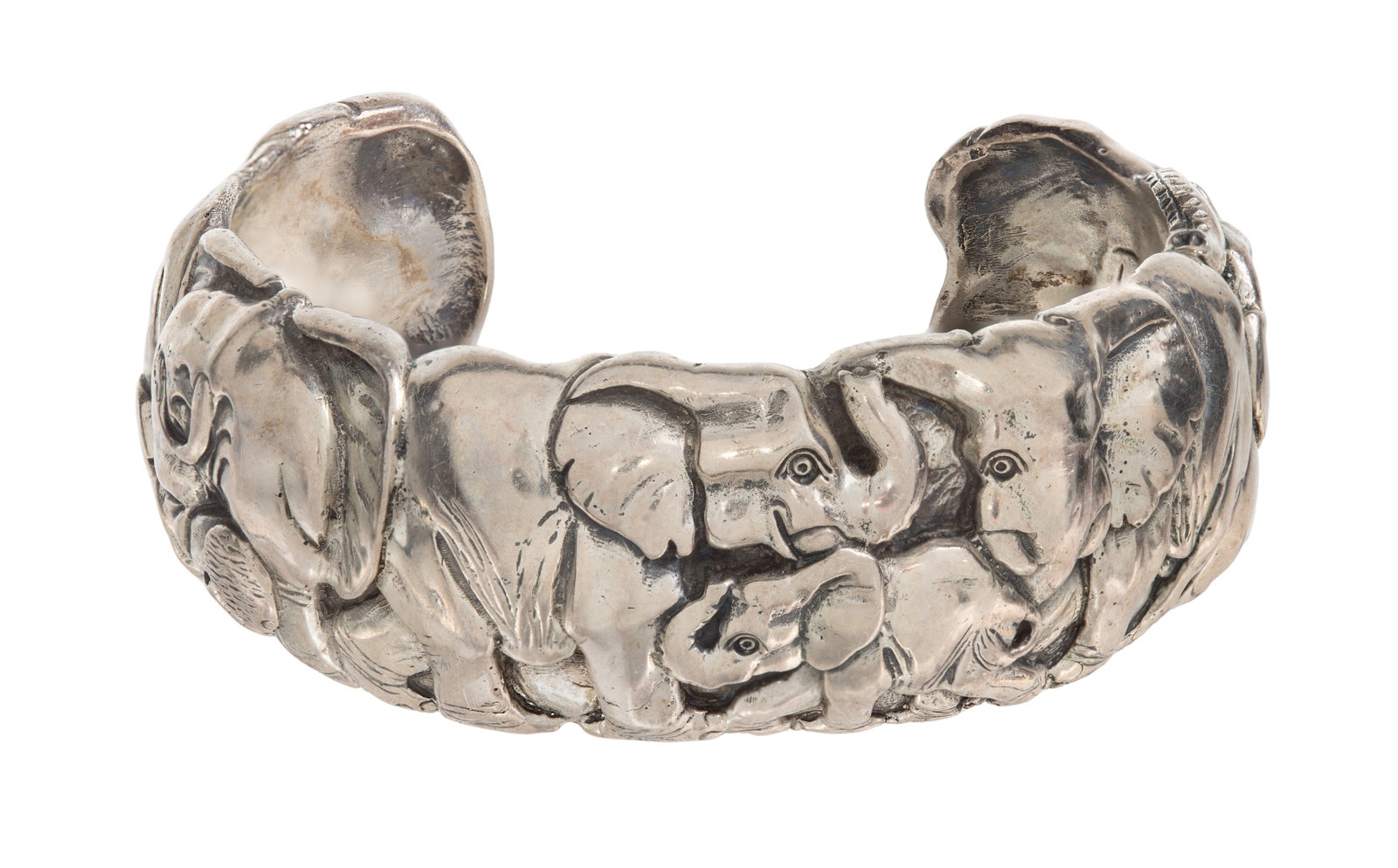 Patrick Mavros Sterling Silver Cuff Bracelet: Patrick Mavros Sterling Silver Cuff Bracelet Designed in relief having a line of elephants in various poses, 1-inch wide (etch signed, unmarked 925) Property from: an Estate, Burr Ridge, Illinois Leng