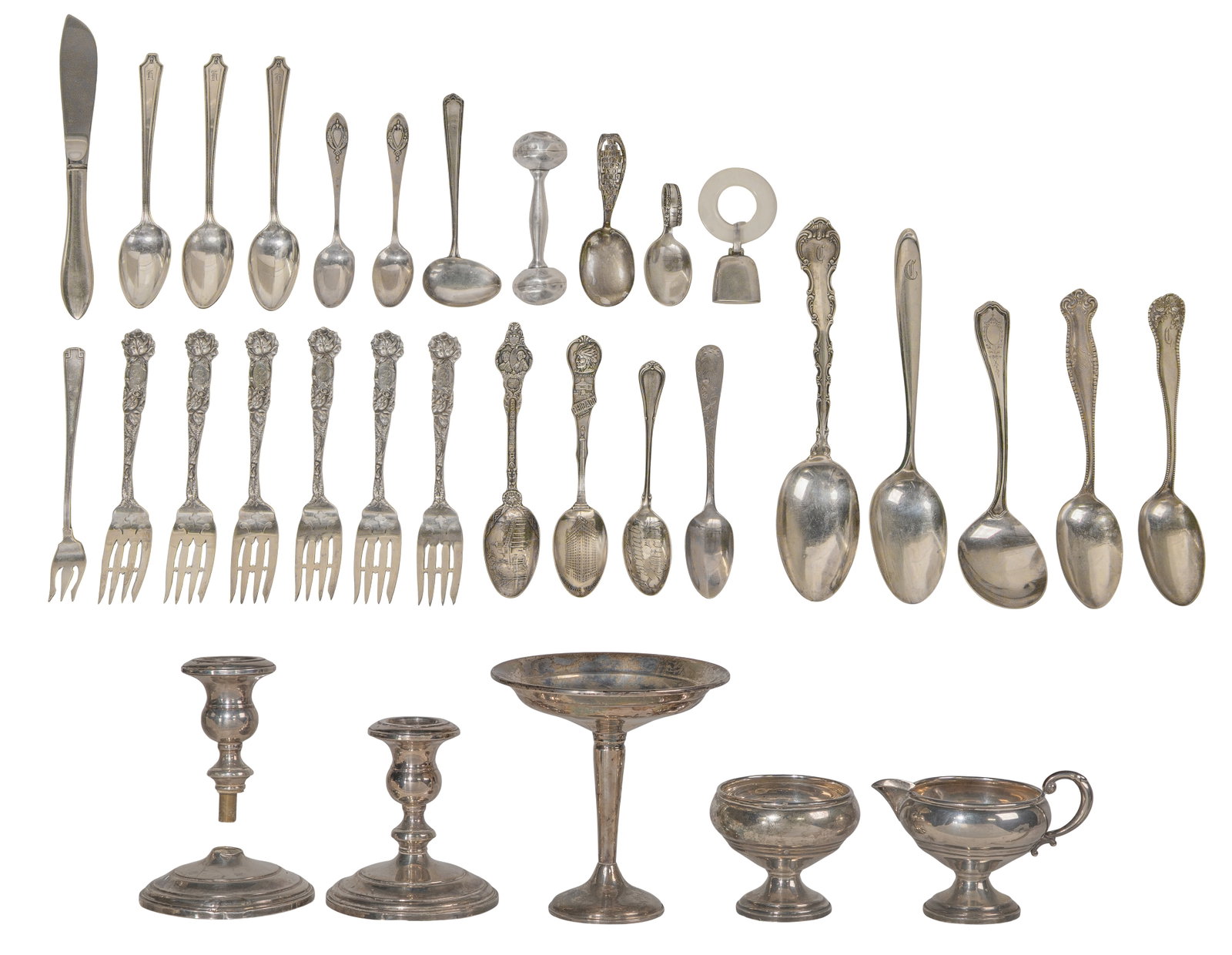 Sterling Silver Object Assortment: Sterling Silver Object Assortment Including a compote, sugar and creamer set, pair of candlesticks, a rattle and teething ring as well as various utensils and souvenir spoons of various shapes, sizes