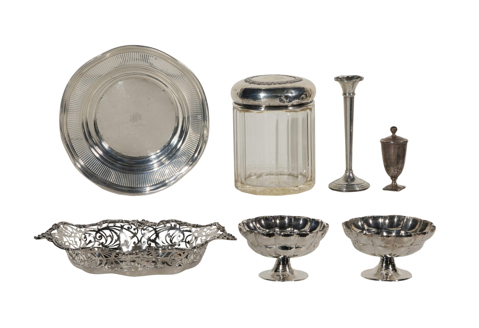 Sterling Silver Tableware Assortment: Sterling Silver Tableware Assortment (7) items including a biscuit jar, (2) footed mint bowls, an oval pierced bowl, a tray, bud vase and a match holder having striker (all marked 'sterling') Property