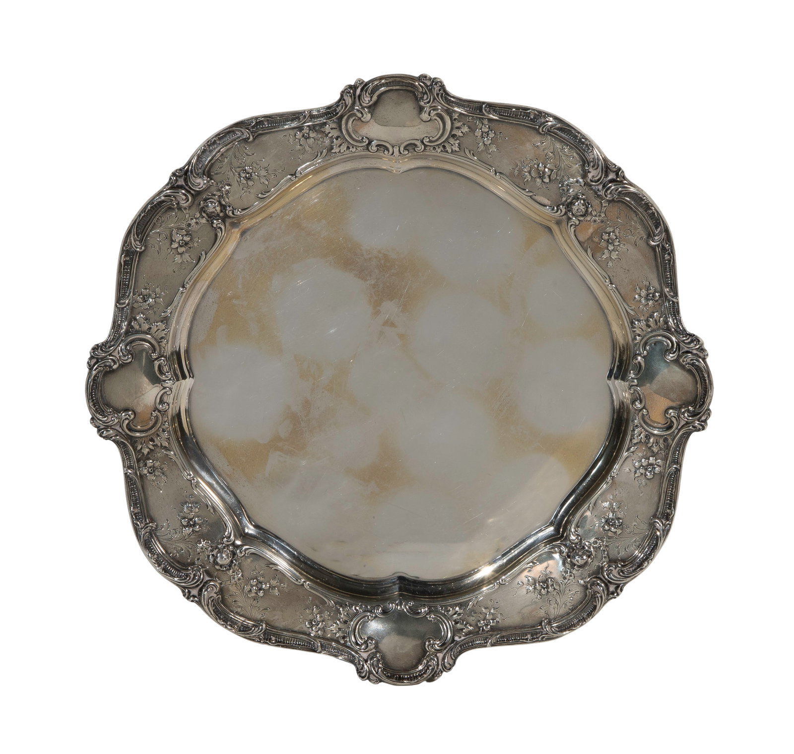 Gorham Sterling Silver Tray: Gorham Sterling Silver Tray Round having a Rococo style rim in a floral and scroll repousse pattern (marked 'sterling') Property from: a Private Collector, Wheaton, Illinois Diameter: 14 1/4 inches We