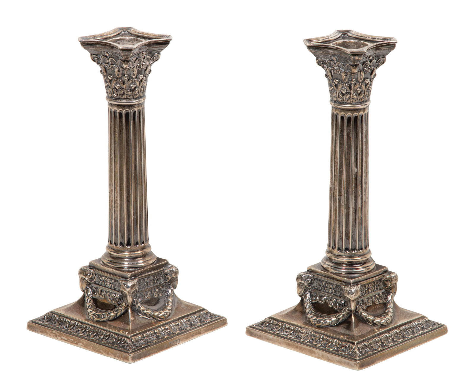 Martin, Hall & Co. Sterling Silver Candlesticks: Martin, Hall & Co. Sterling Silver Candlesticks A pair of candlesticks having a Corinthian column motif, rams head mounts and garland swags (hallmarked, marked lion passant) Property from: a Private