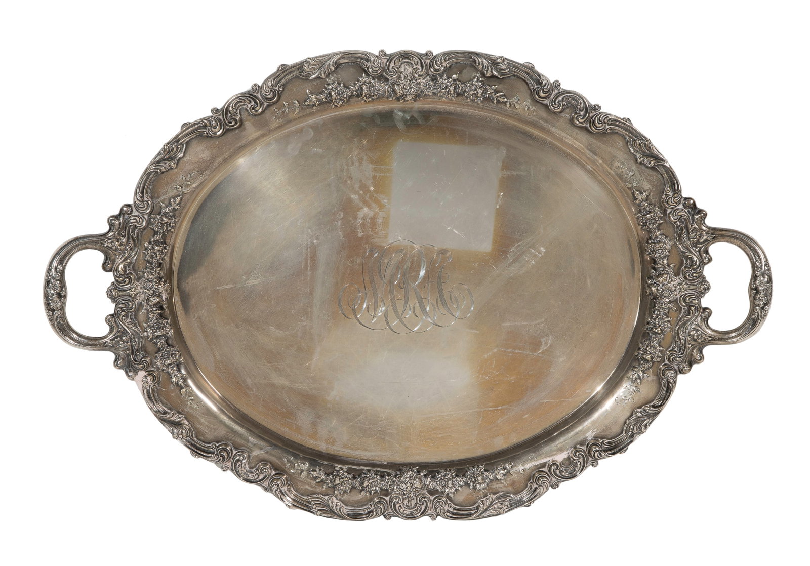 Redlich & Company Sterling Silver Tray: Redlich & Company Sterling Silver Tray Two-handled oval tray having a Rococo rim in a floral and scroll repousse pattern (marked 'sterling') Property from: a Private Collector, Wheaton, Illinois