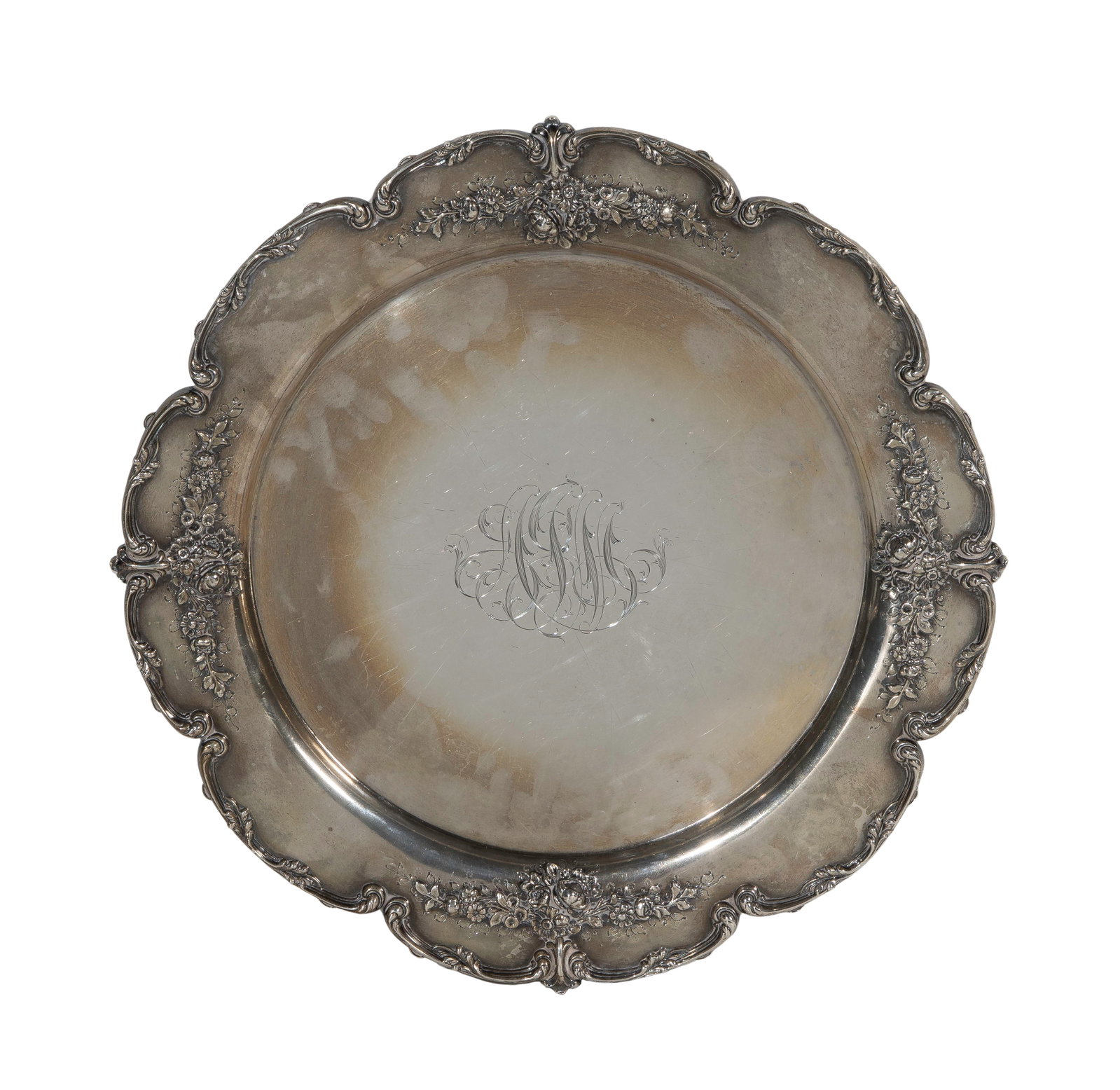 The Bailey Banks & Biddle Company Sterling Silver Tray: The Bailey Banks & Biddle Company Sterling Silver Tray Round having a floral and scroll accent on a scalloped rim (marked 'sterling') Property from: a Private Collector, Wheaton, Illinois Diameter:
