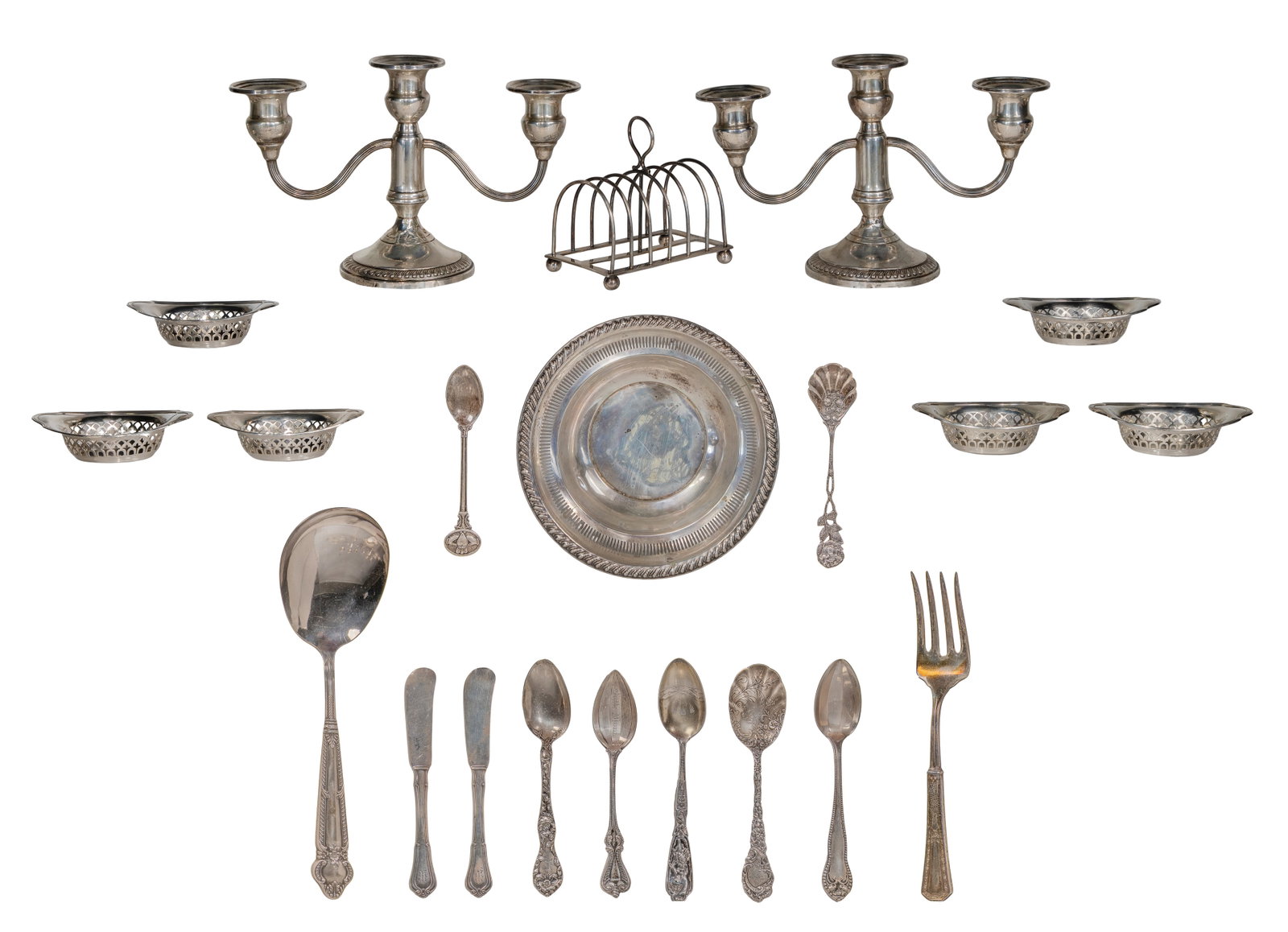 Sterling Silver Object Assortment: Sterling Silver Object Assortment (21) items including a toast rack and set of (6) reticulated oval nut dishes (lion passant mark), a reticulated serving bowl, (2) berry spoons, (2) teaspoons, (2) sou