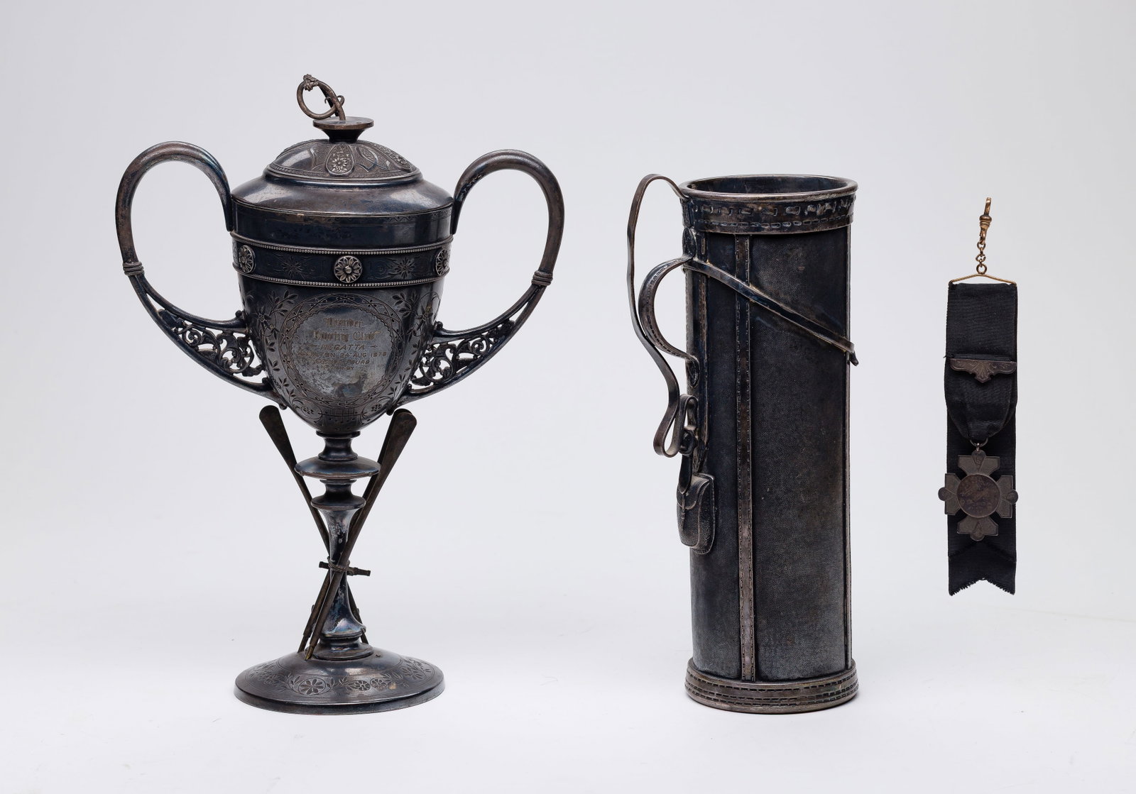 Derby Silver Company Golf Bag Cocktail Shaker: Derby Silver Company Golf Bag Cocktail Shaker (3) total items including a cocktail shaker in the form of a golf bag; together with an 1878 rowing trophy and a canoe medal on ribbon Property from: a