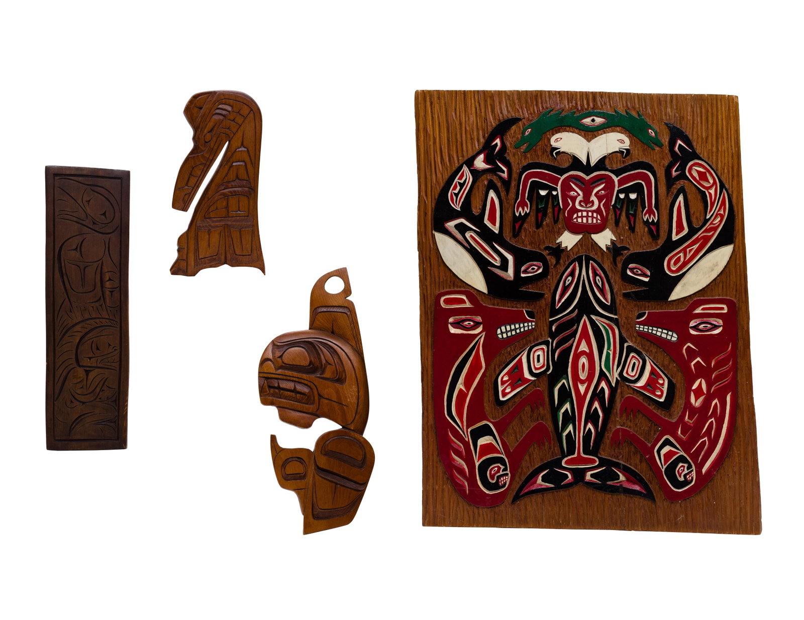 Northwest Coast Wood Carving Assortment: Northwest Coast Wood Carving Assortment (4) items including an unsigned Stephan Charlie carved and painted cedar panel depicting totemic images, a carved killer whale pencil signed 'Dave Harper', a