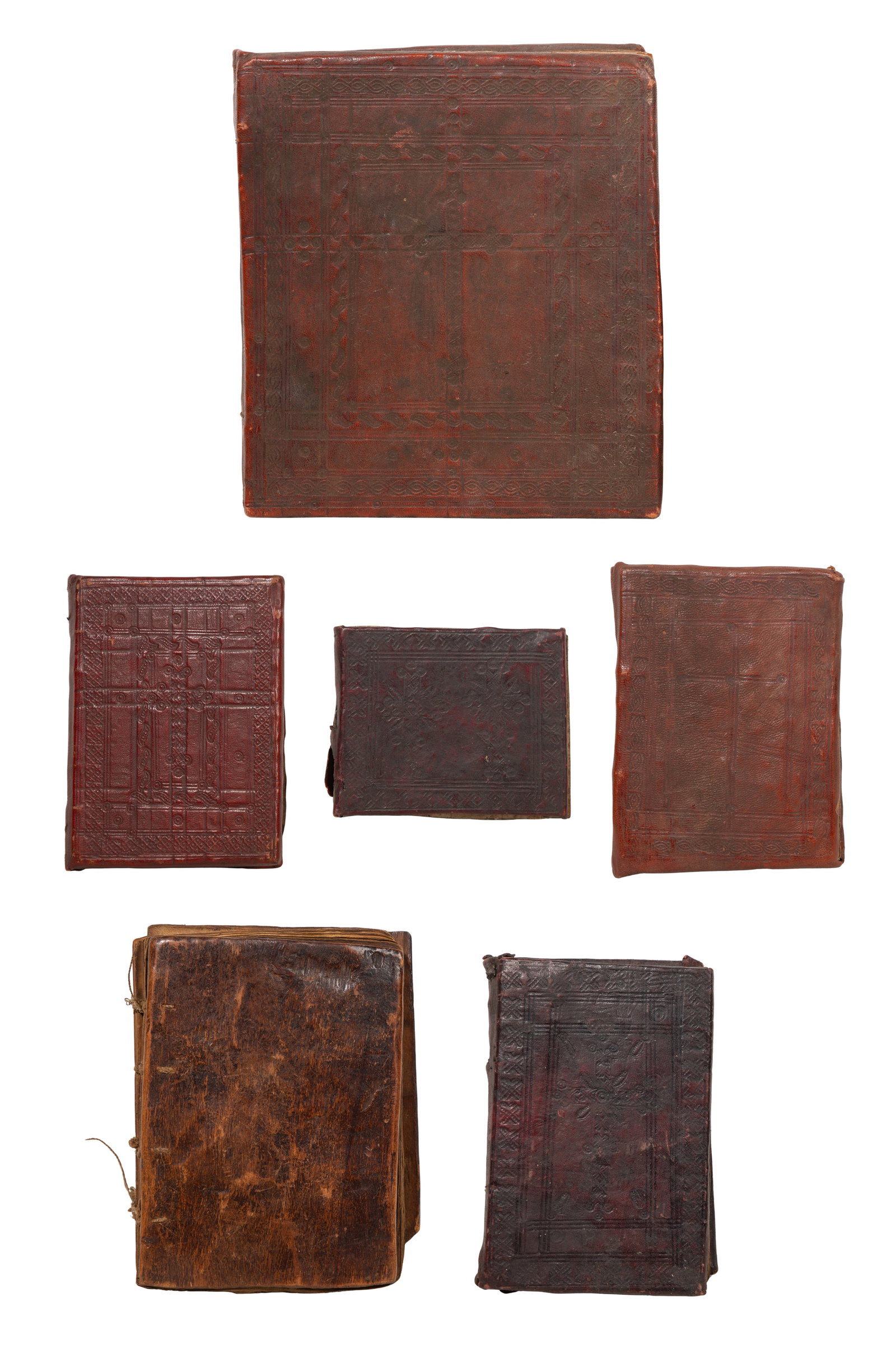 Ethiopian Coptic Illuminated Manuscript Assortment: Ethiopian Coptic Illuminated Manuscript Assortment (6) items, all hand printed and illuminated on vellum, bound between leather covered wood boards, most ruled and stamped in blind Property from: a