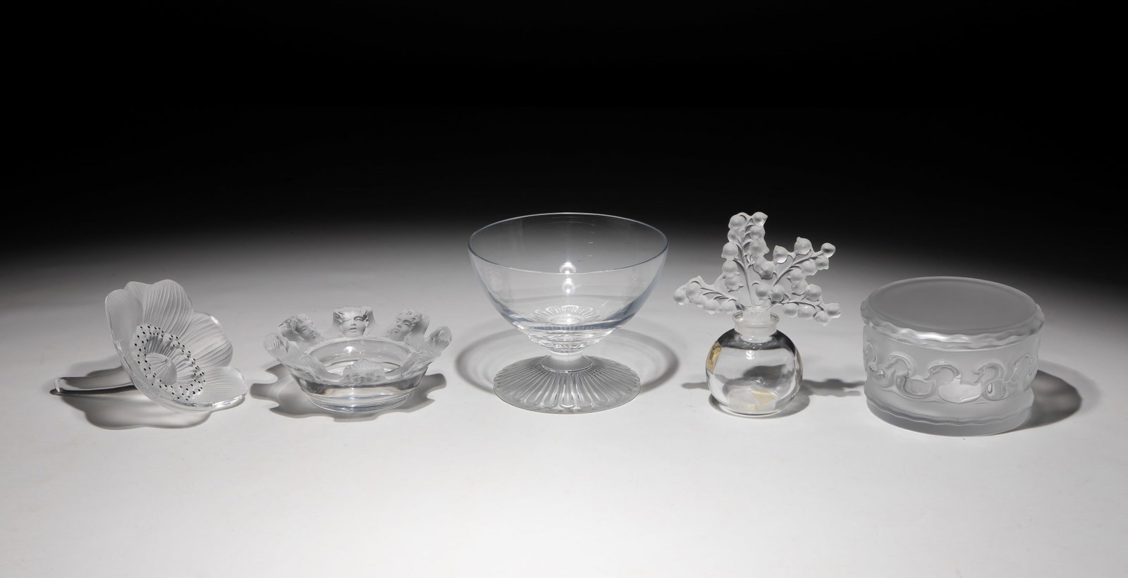 Lalique Crystal Assortment: Lalique Crystal Assortment (5) items including a frosted glass Anemone paperweight, a Saint-Nicolas trinket dish / ashtray, a Roxane blown crystal bowl having a frosted stem, a Muguet rounded clear