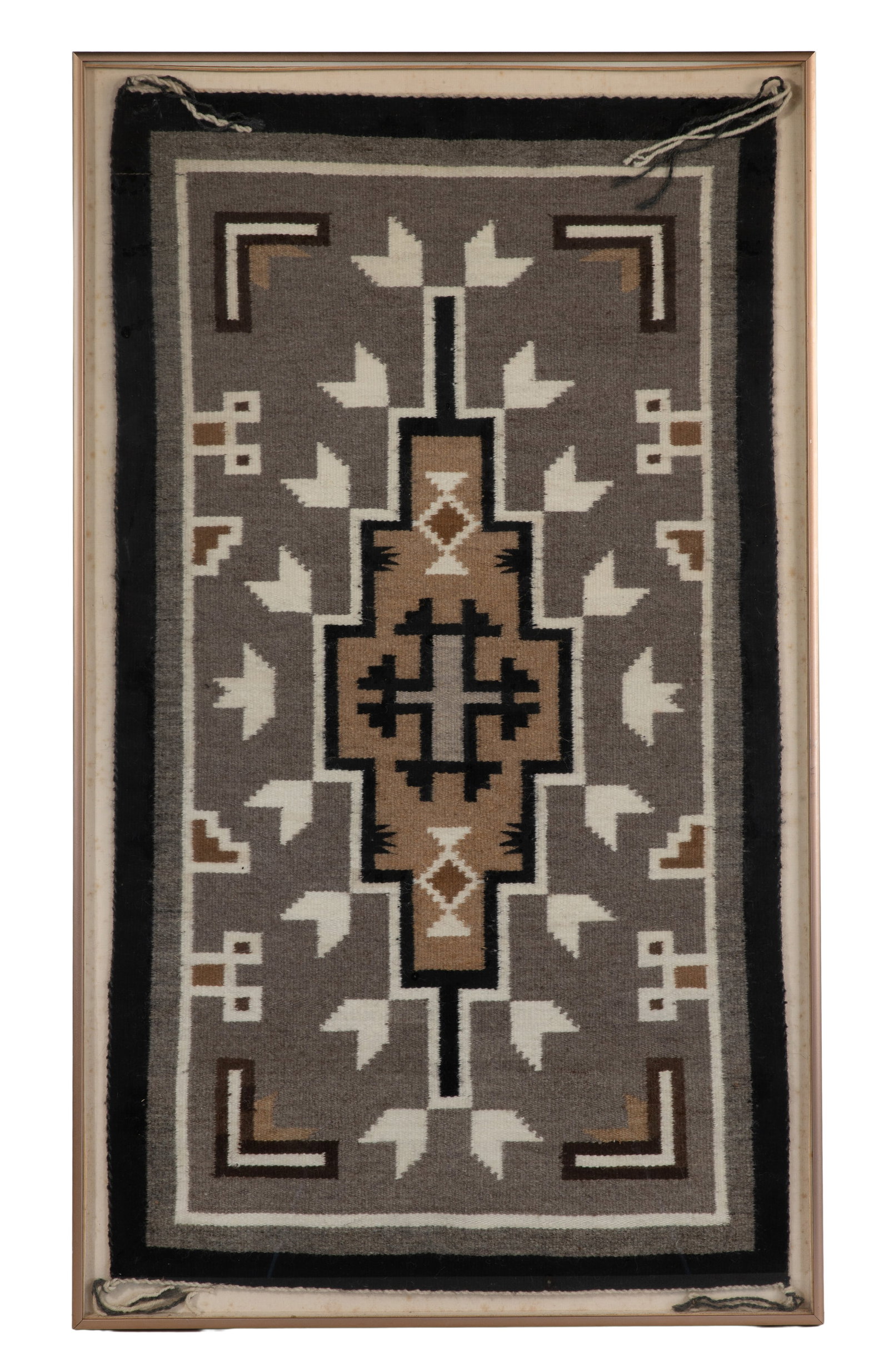 Native American Navajo Rug: Native American Navajo Rug Having a geometric design in gray, black, brown and white, mounted in a brushed metal frame Property from: a Private Collector, Evanston, Illinois Height: 26 inches, Width: