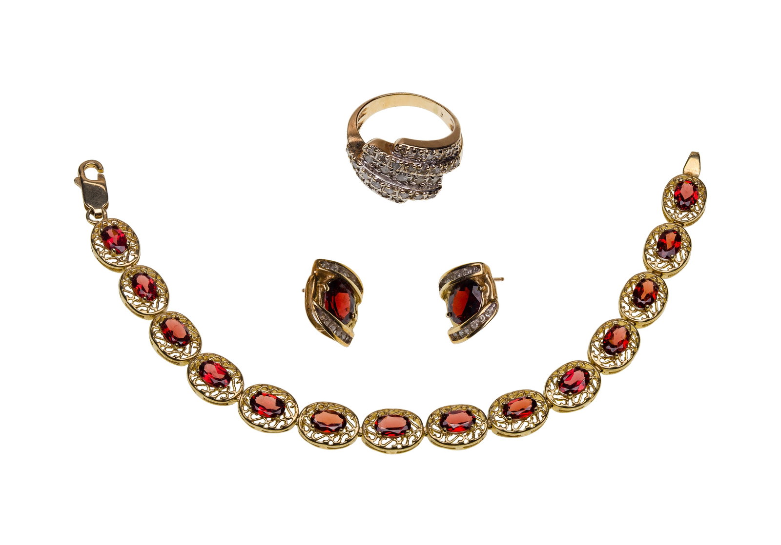 10k Yellow Gold Jewelry Assortment: 10k Yellow Gold Jewelry Assortment (3) items including a multi-row diamond encrusted cocktail ring in a cross over design and an oval cut garnet bracelet and pair of pierced earrings (marked '10k')