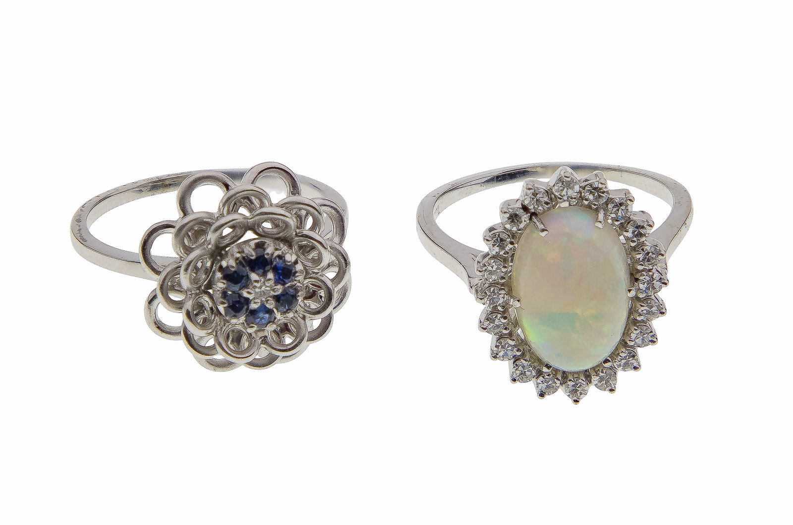 18k White Gold Ring Assortment: 18k White Gold Ring Assortment (2) items including an oval opal having a round cut diamond halo (marked '18k') and a sapphire and diamond cluster (unmarked 18k) Property from: an Estate, Burr Ridge,