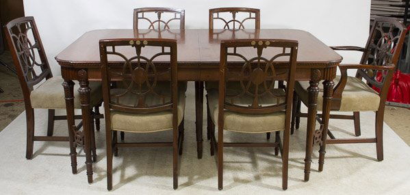 Sheraton Style Mahogany Dining Table with Chairs: Sheraton Style Mahogany Dining Table with Chairs Double spindle corner and center support legs, includes matching Captain and five side chairs with two leaves Height: 30.50 inches, Length: 66.00 inche