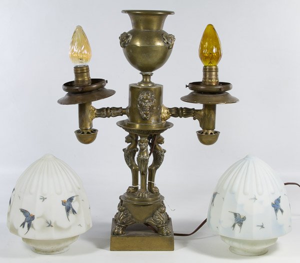 Double Light Student Lamp: Double Light Student Lamp Having a metal base with four paws, griffins and mask face with two opaque bird decorated globes Height: 19.00 inches, Width: 14.50 inches Category: Decorative Arts > Lamps S