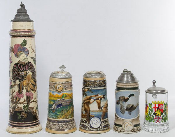 Beer Stein Assortment: Beer Stein Assortment Including a large German beer stein, one small clear German stein and three 'Ducks Unlimited' steins Height: 19.00 inches (largest) Category: Porcelain and Ceramics > Bavarian Sh