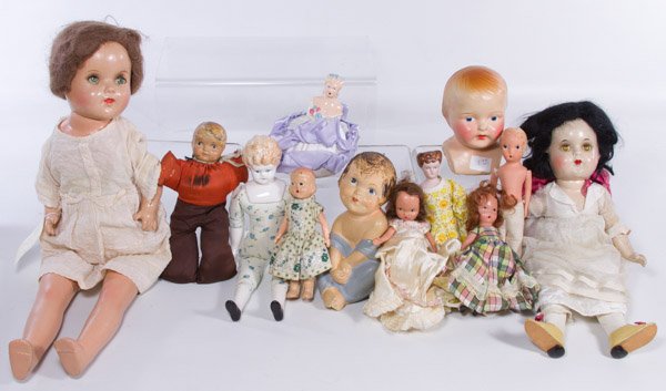 Composition Doll Assortment: Composition Doll Assortment Twelve dolls including a Madame Alexander Snow White, Nancy Ann Storybook, a 'Tiss-Me' figurine, a pin cushion doll and antique reproduction china head dolls Height: 19.00