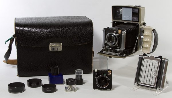 Technika 70 Camera and Accessories: Technika 70 Camera and Accessories Carrying case includes Symmar 1:5.6/100 lens, Super-Angulon 1:8/65 lens, additional back and attached flash Height: 8.00 inches, Width: 9.00 inches, Depth: 4.50 inch