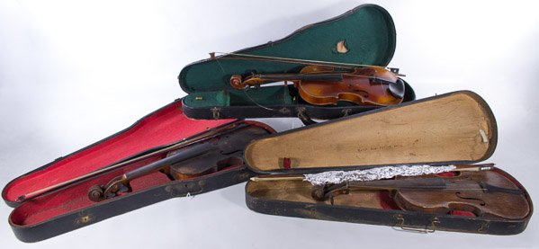 Violins in Cases with Bows: Violins in Cases with Bows Three violins in cases together with three bows; one violin marked 'Copy of Jacobus Stainer' Category: Musical Instruments > Violins Shipping Status: 3rd Party Shipping; the