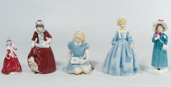 Royal Doulton and Royal Worchester Figurine Assortment: Royal Doulton and Royal Worchester Figurine Assortment Five figurines including Alice in Wonderland, Grandma's Dress, Best Wishes, Carrie, Christmas Morn, and a Japanese wood display stand Height: 6.2