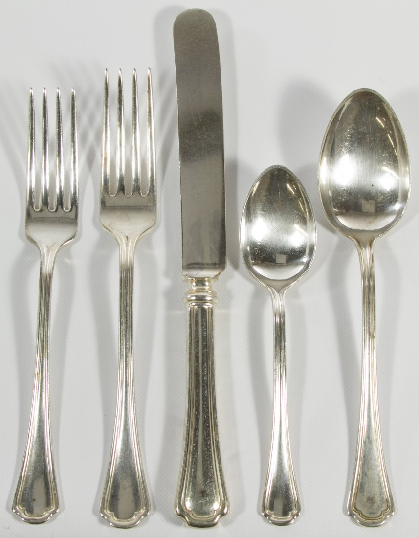 Burley & Co Silverplate Flatware: Burley & Co Silverplate Flatware Including (11) knives, (12) forks, (12) salad forks, (12) teaspoons, (12) soup spoons and (5) serving spoons; possibly railroad or restaurant flatware Category: Silver