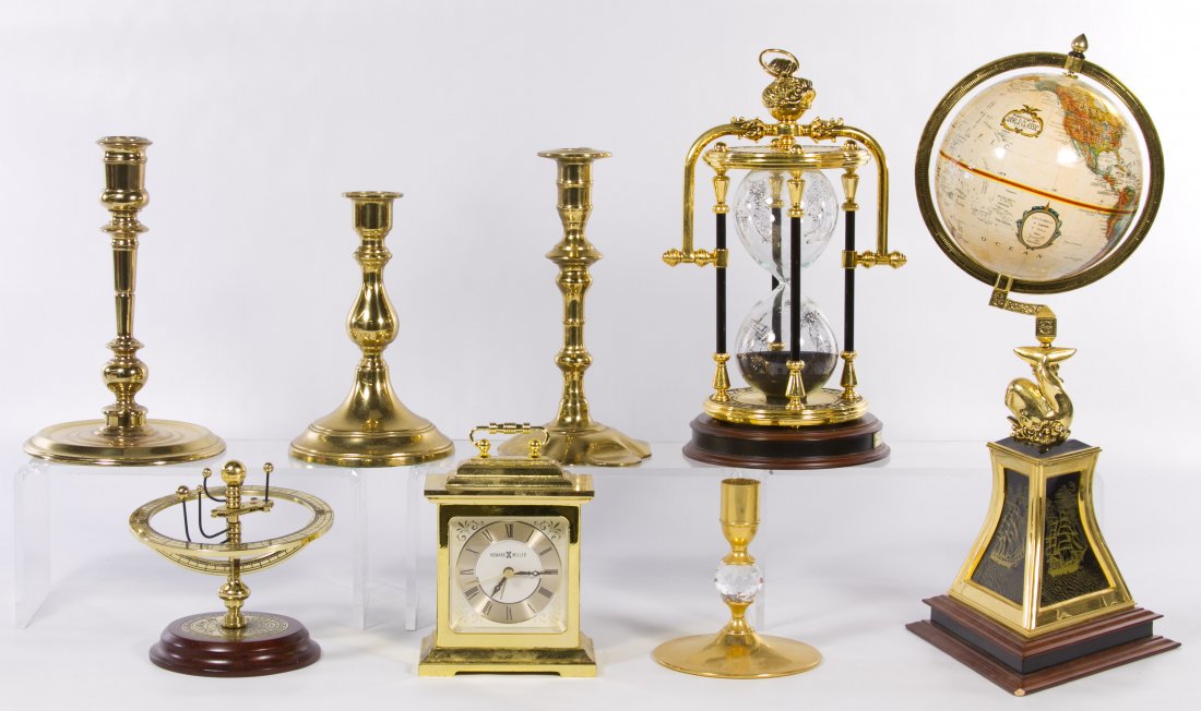 Brass Clock, Candlestick and Globe Assortment: Brass Clock, Candlestick and Globe Assortment Eight items including a Howard Miller carriage clock 613-279, four mismatched candlesticks, a Franklin Mint Navigator Globe, an hour glass and an Orrery H