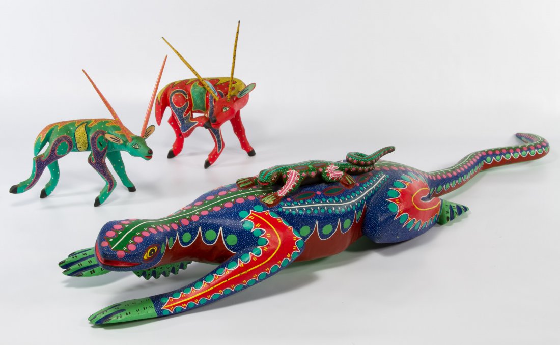 Oaxacan Wood Carvings: Oaxacan Wood Carvings Three items including a large lizard painted by Pedro Ramirez and two smaller animals painted by Jesus Molchor in 1995 Height: 6.50 inches, Width: 33.00 inches (lizard) Category: